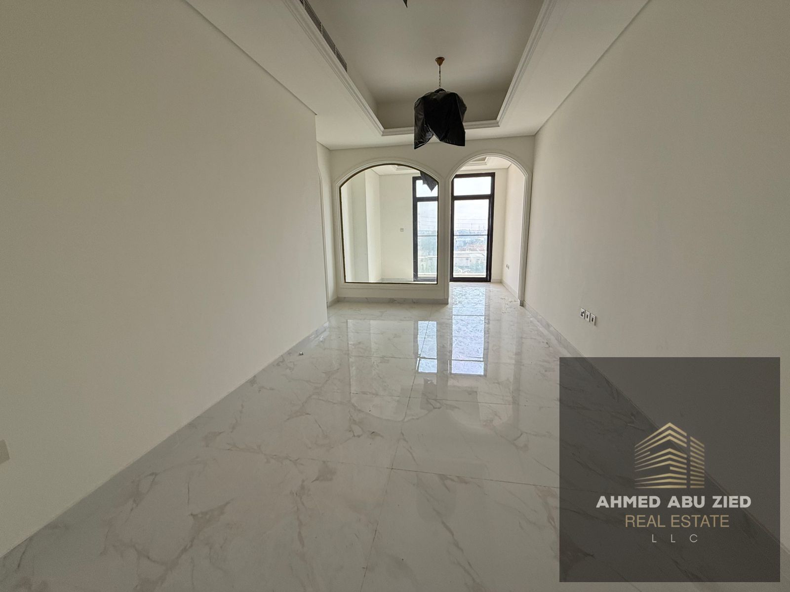 3BR+hall apartment for annual rent in Ajman. Brand new, first tenant, 1 month free, free pool, built-in wardrobes, prime location on MBZ Road.