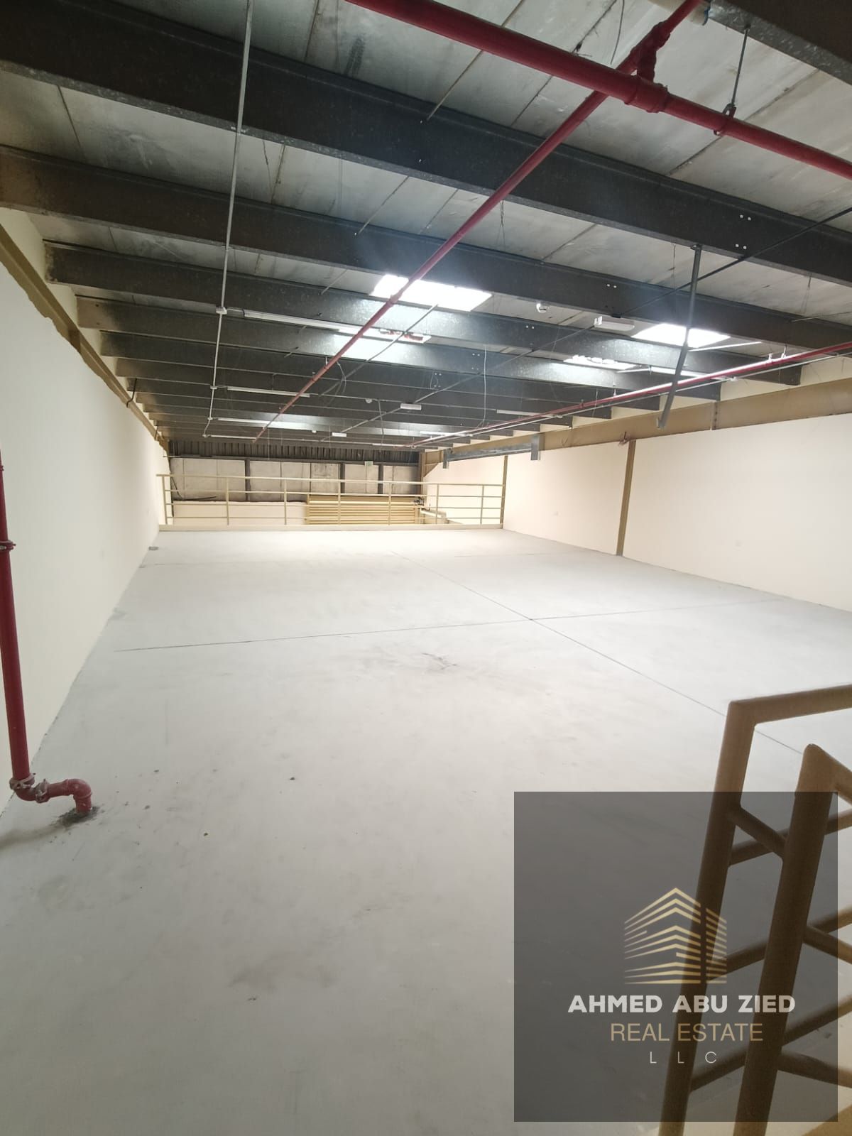 Annual warehouse for rent with mezzanine and 22 kW power in Al Jurf Industrial 1, on a main road, close to Sheikh Mohammed bin Zayed Rd, exit to Dubai