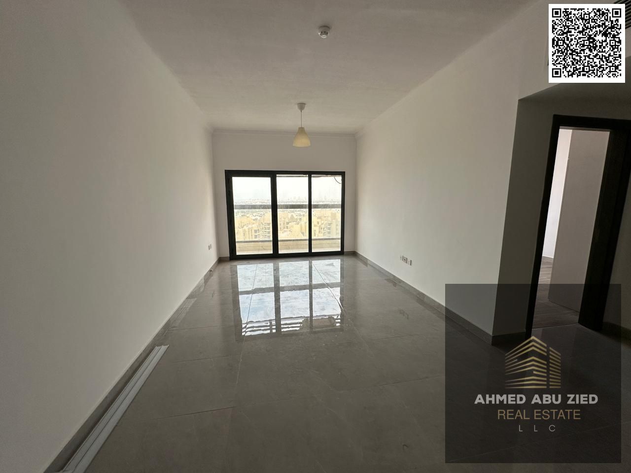 Beautiful 1BR hall apartment in Al Rashidiya 1 with 2 baths, balcony, built-in wardrobes, central AC, gym, pool & aqua park.