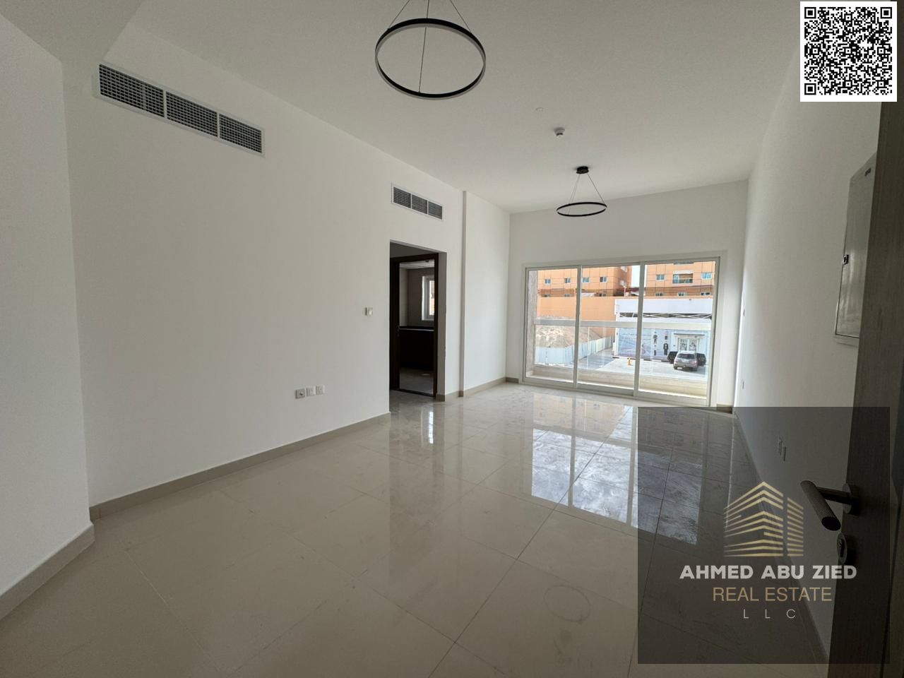 First tenant 1BR hall Jurf3 | Master bedroom, 2 baths, wide hall, equipped kitchen, central AC, balcony | Near schools & Dubai exit