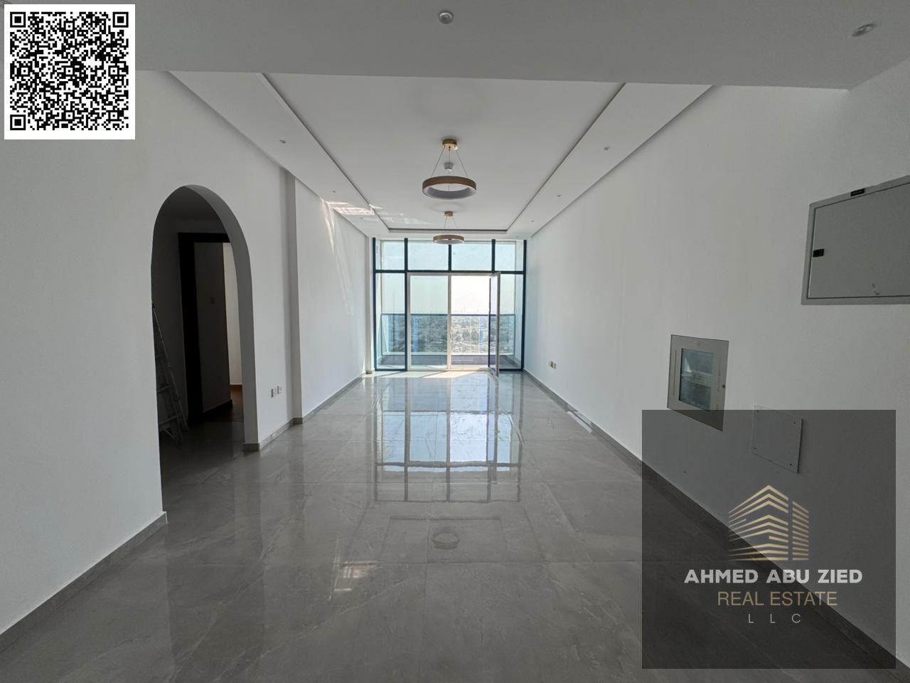 Brand-new 2BR hall in Al Nuaimiya 3; central AC, open-view balcony, large kitchen, 2 baths, prime location close to Sharjah exit.