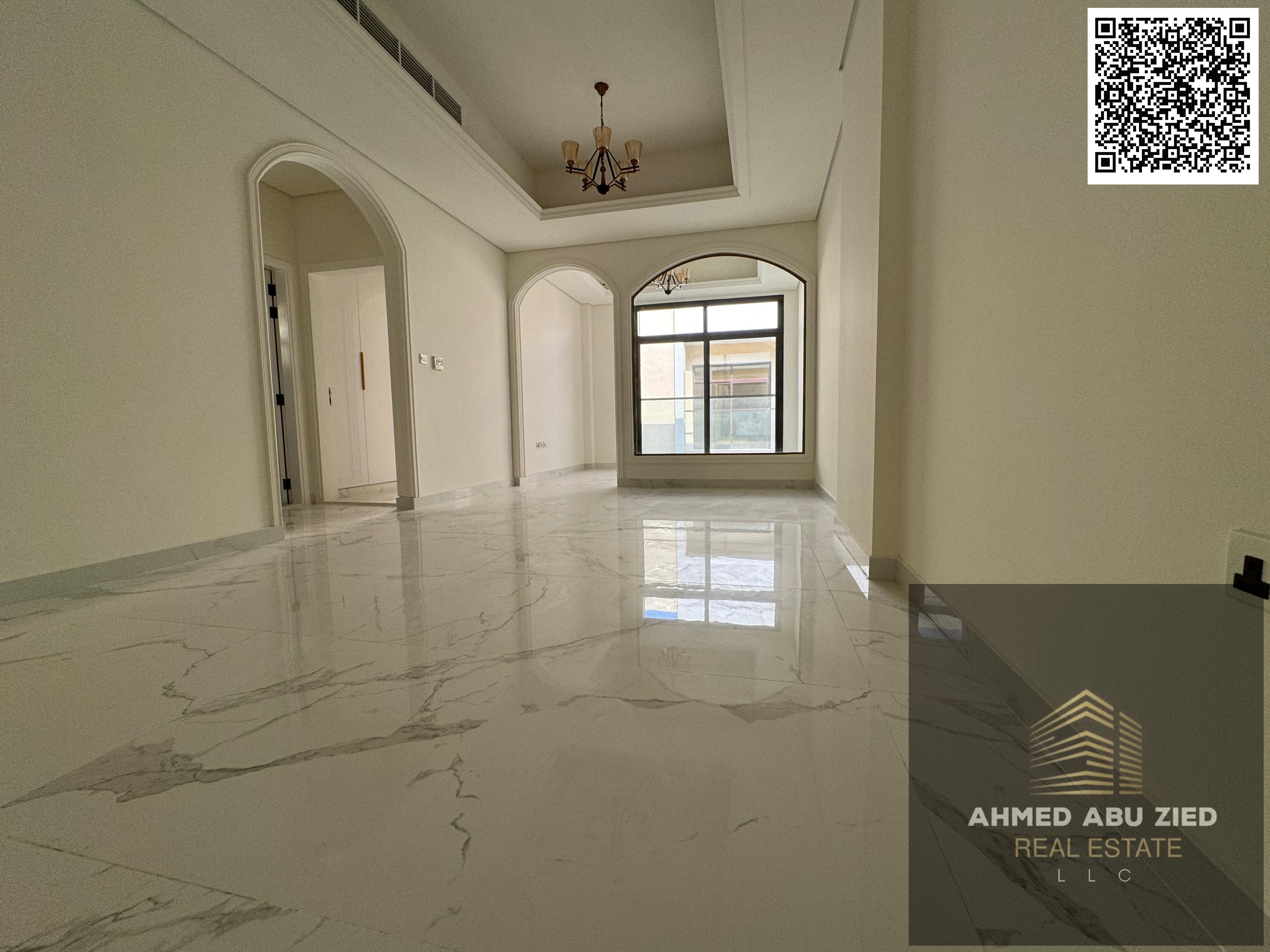 First-tenant 1BR + hall + majlis in Al Tallah | Balcony, 2 baths, fitted kitchen, built-in wardrobes, separate majlis | With free month, AED 45,000.