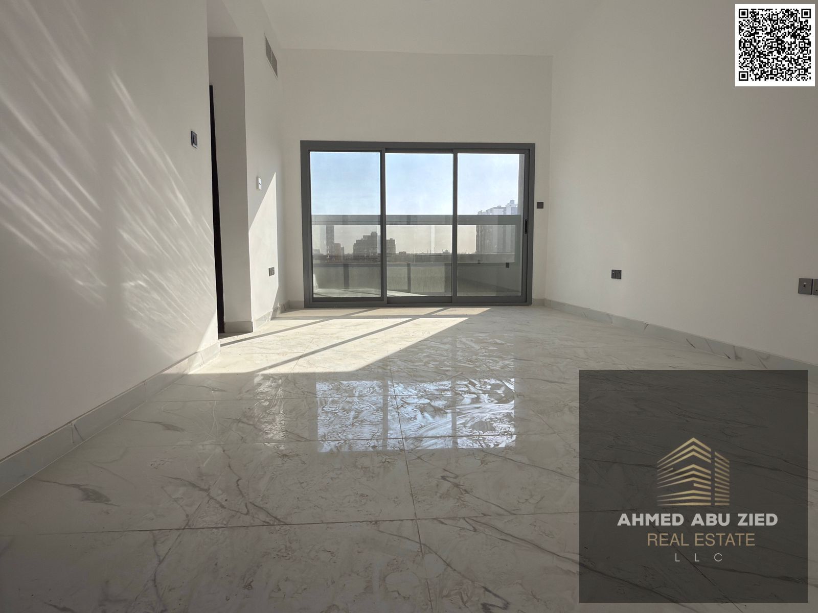 Luxury first-tenant 1BR apartment for annual rent in Al Jurf 3, master bedroom with wardrobes, 2 baths, spacious living with balcony, fitted kitchen.
