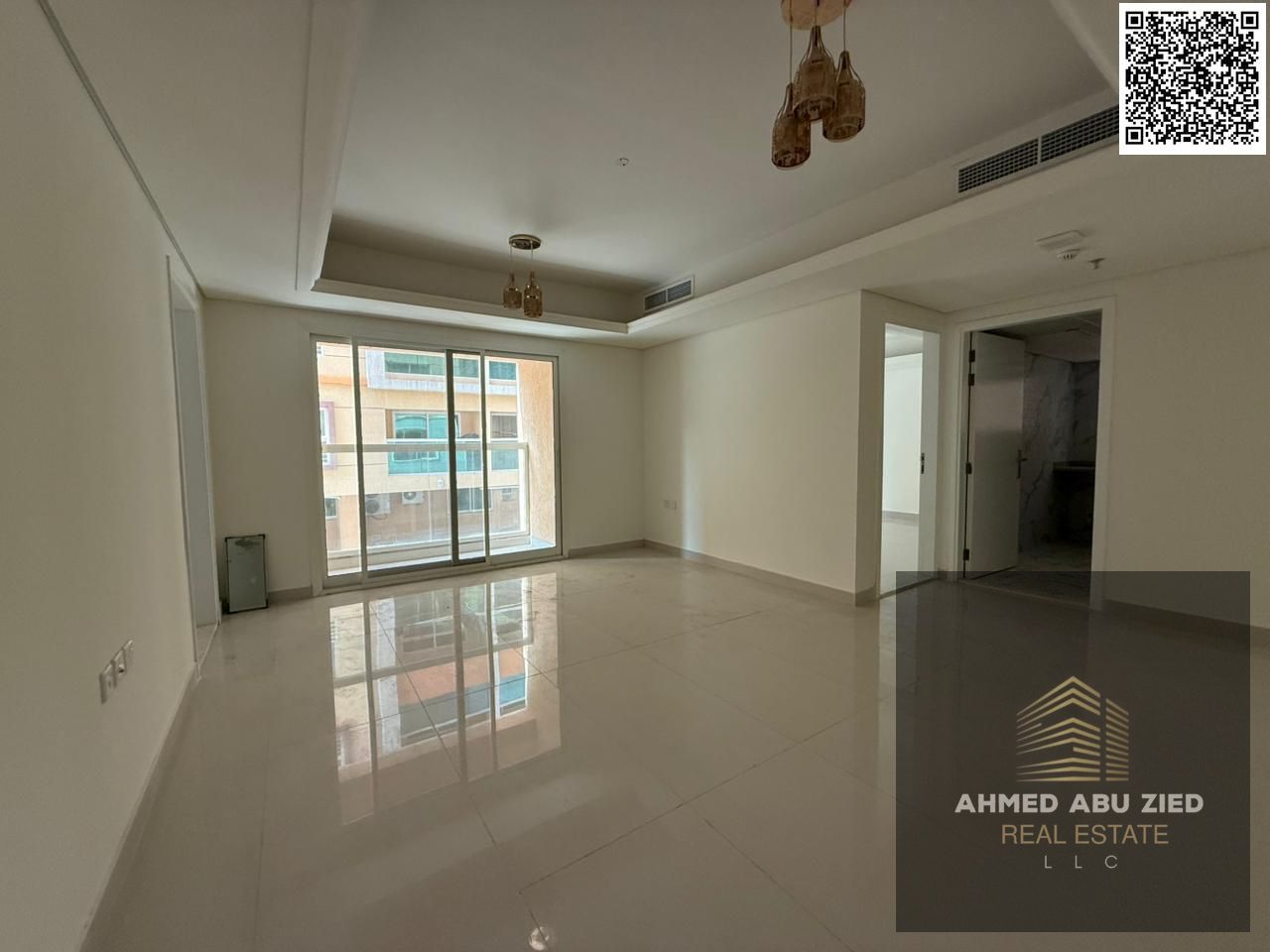 Luxury 1BR apartment with gym & pool in Mowaihat 3. Master bedroom with wardrobes, 2 baths, laundry room, near schools, 1 month free.