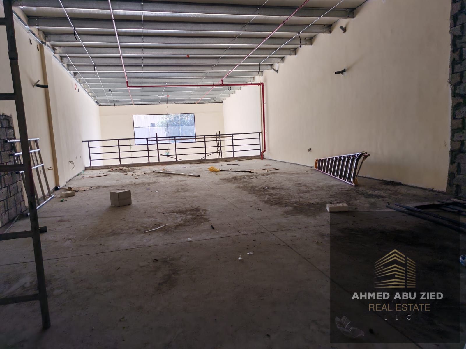 Mezzanine floor for rent in Ajman Industrial 2, a vital location on the main street, suitable for a warehouse or showroom, area 4000 square feet, rent