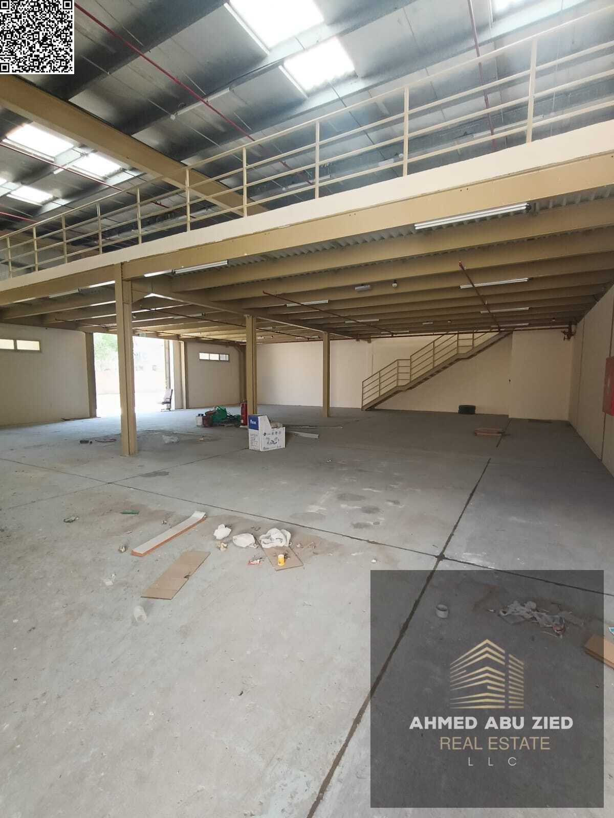 Warehouse for annual rent in Al Jurf 1 - with a large additional mezzanine area - equipped with a high-voltage 22 kW electric pump - 2 bathrooms - are