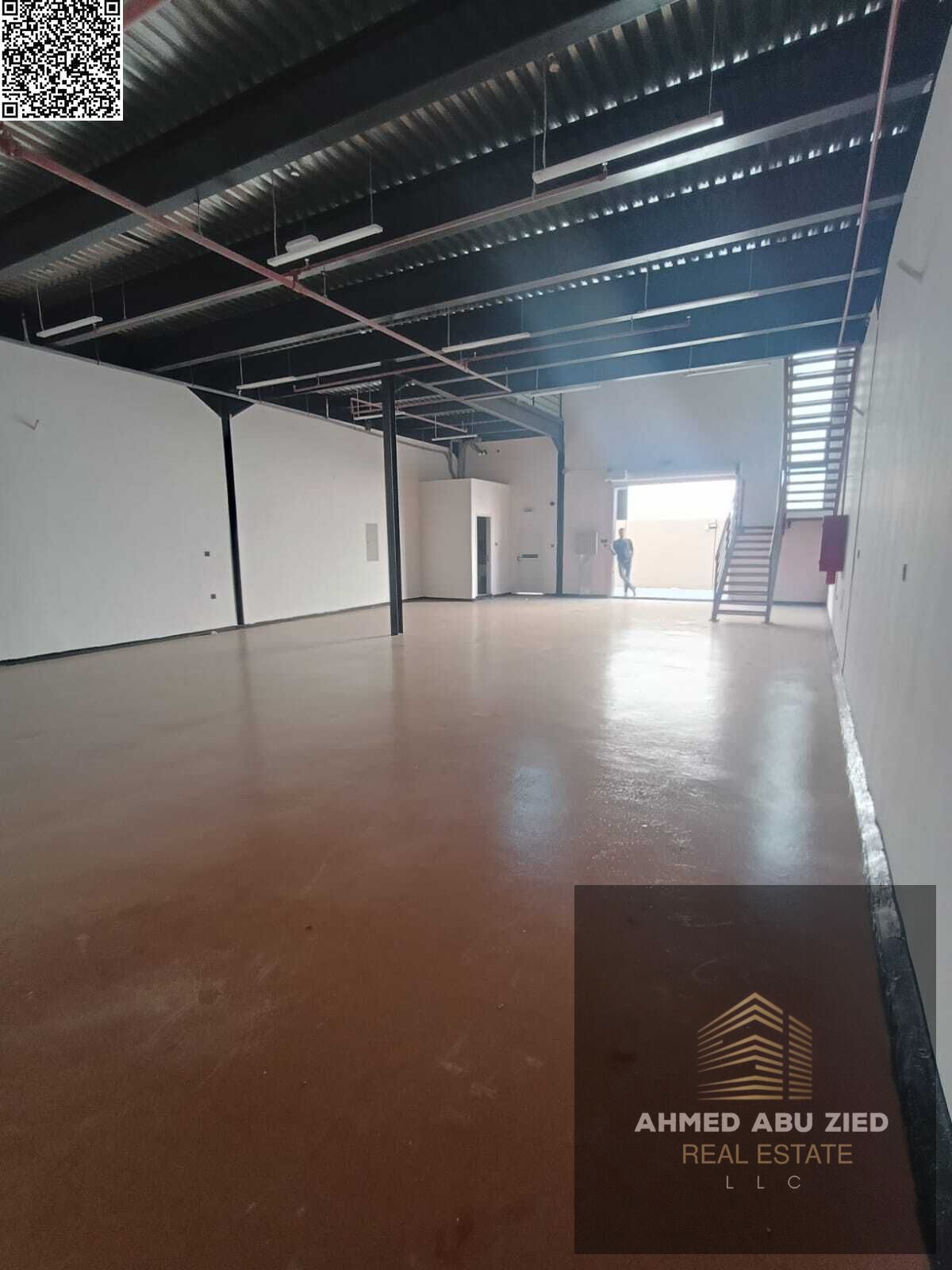 Warehouse for annual rent in Al Jurf 1 - with a large additional mezzanine area - equipped with a high-voltage 57 kW electric pump - 2 bathrooms - are