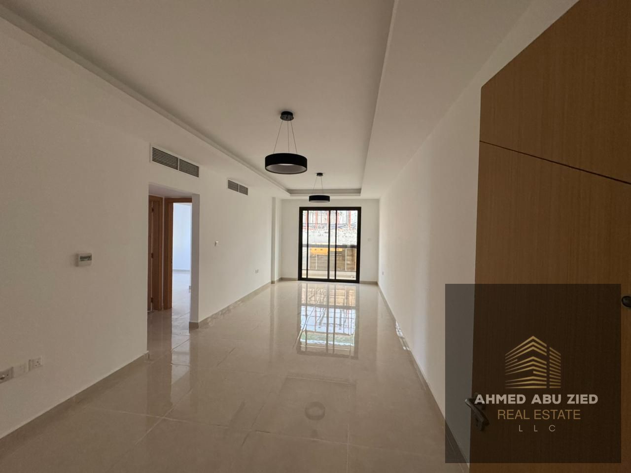 Two bedrooms and a living room, first occupancy, spacious, for annual rent with a balcony, 3 bathrooms, one month free, central gas, near Mohammed Bin