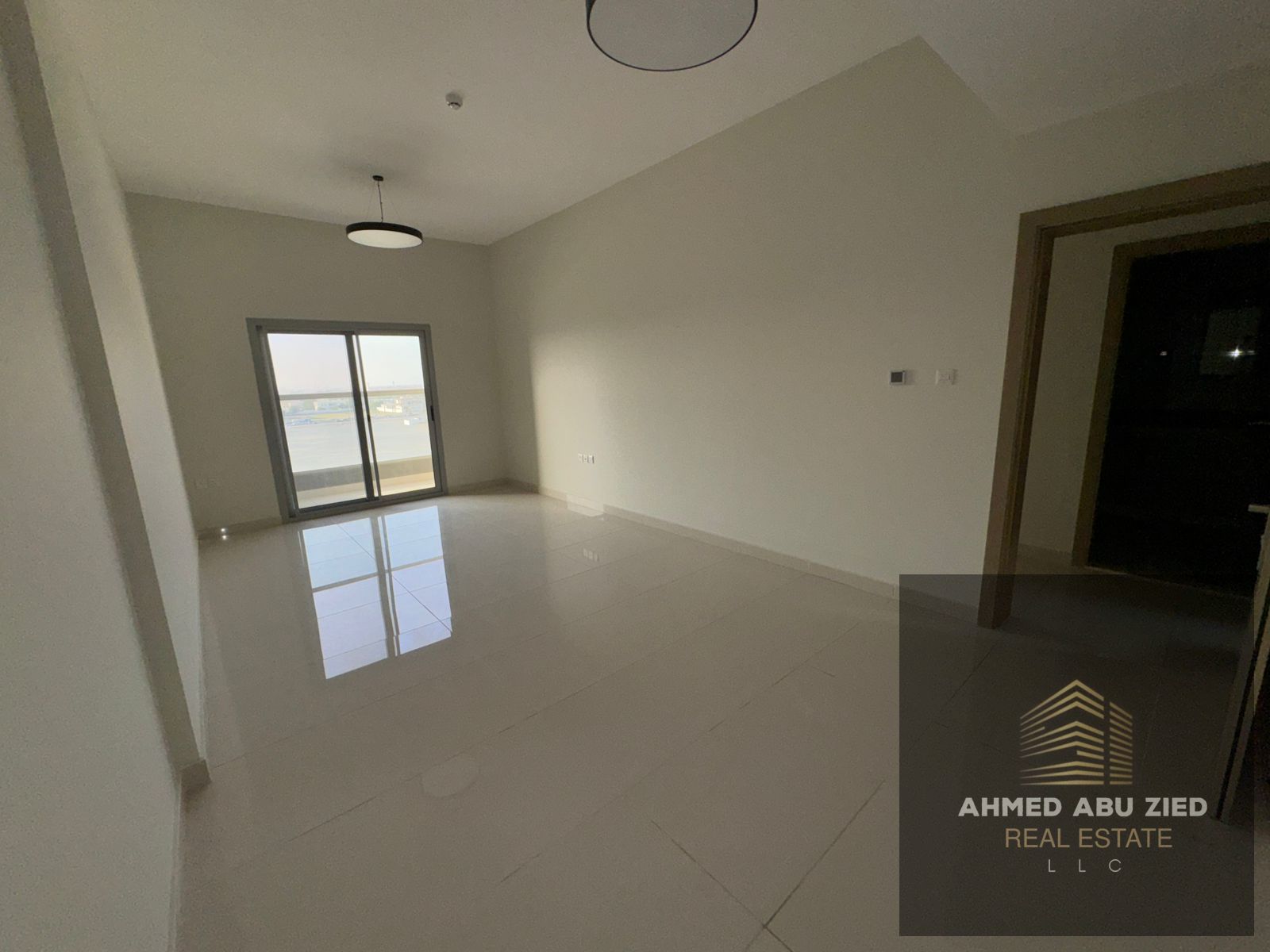 Luxury apartment for annual rent in Al Jurf 2, Ajman – featuring a master bedroom, hall, 2 bathrooms, balcony, built-in wardrobes, central AC, and fre