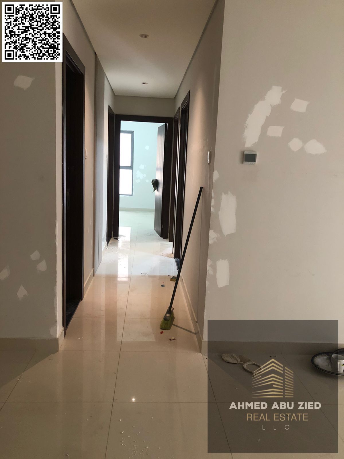 Beautiful two-bedroom apartment with a living room, two bathrooms, central air conditioning, balcony with an open view, excellent finishing, and a ver