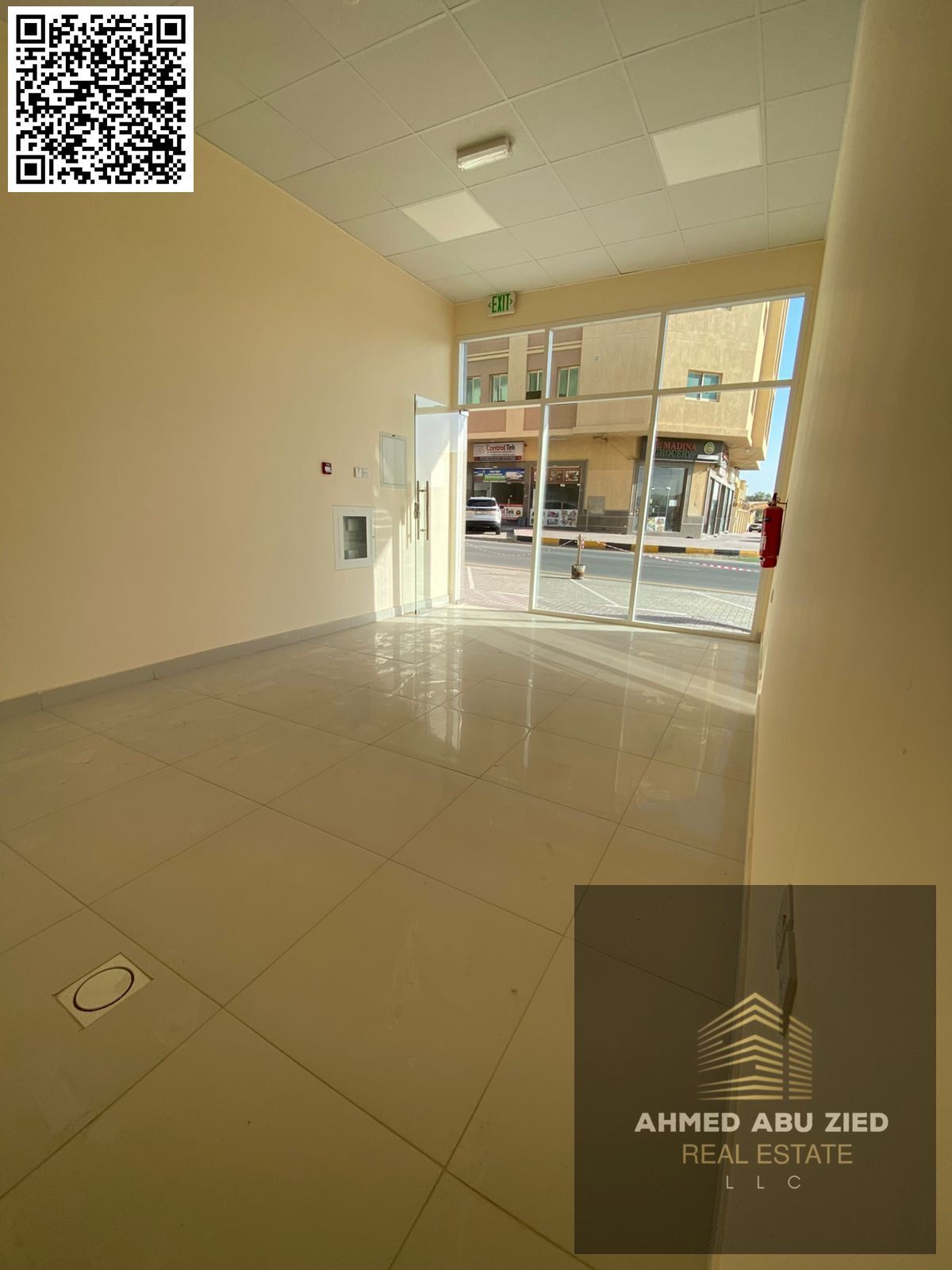 Shop for annual rent in Al Rawda 1, Ajman, with a large area and a prime location next to Khalifa Bin Zayed Street and Sheikh Ammar Street, suitable f