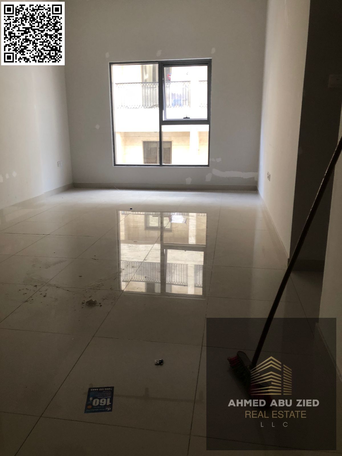 Beautiful two-bedroom apartment with a living room and two bathrooms, central air conditioning, glass windows, excellent finishing, and a prime locati