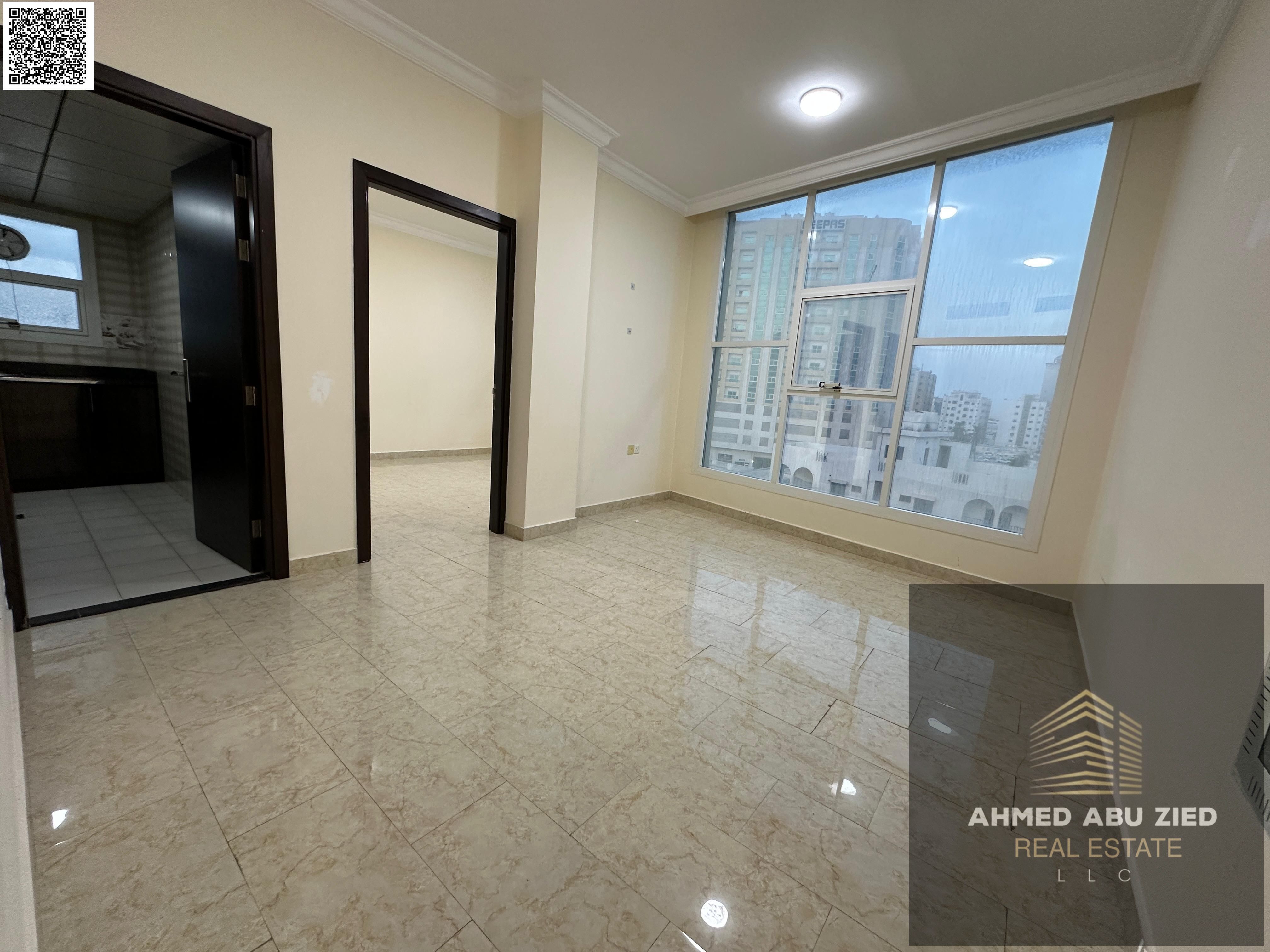 A 1-bedroom apartment with a hall for annual rent in Ajman, close to Ajman Corniche, in a new building, near all services, with payment in 6 cheques.