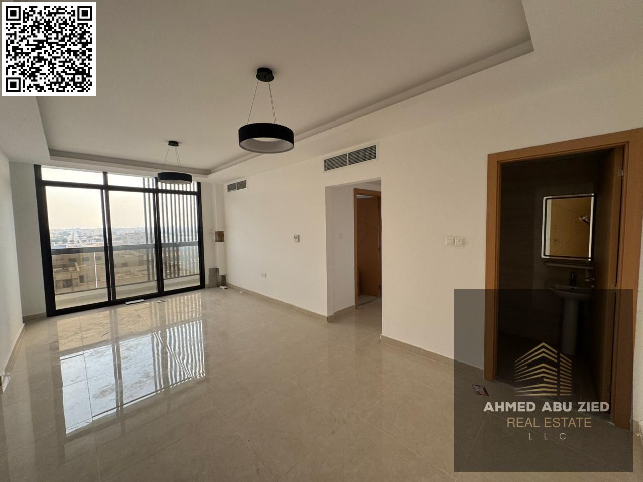 Two bedrooms and a living room, first occupancy in Al Jurf 3, with a balcony and three bathrooms, available for annual rent. Flexible payment options,