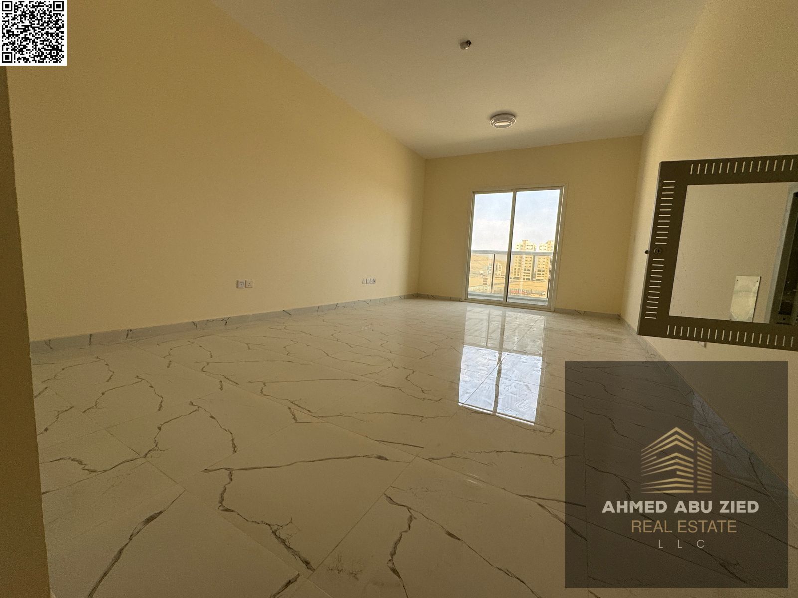 First occupancy apartment with a master bedroom, maid's room, and living room in Al Jurf 3, in a clean and quiet building with a balcony offering an o