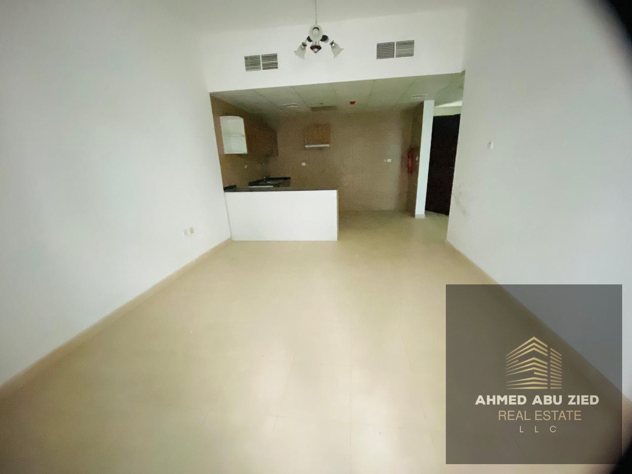 For sale in City Towers: a spacious one-bedroom apartment with a living room, balcony, large kitchen, and private parking.