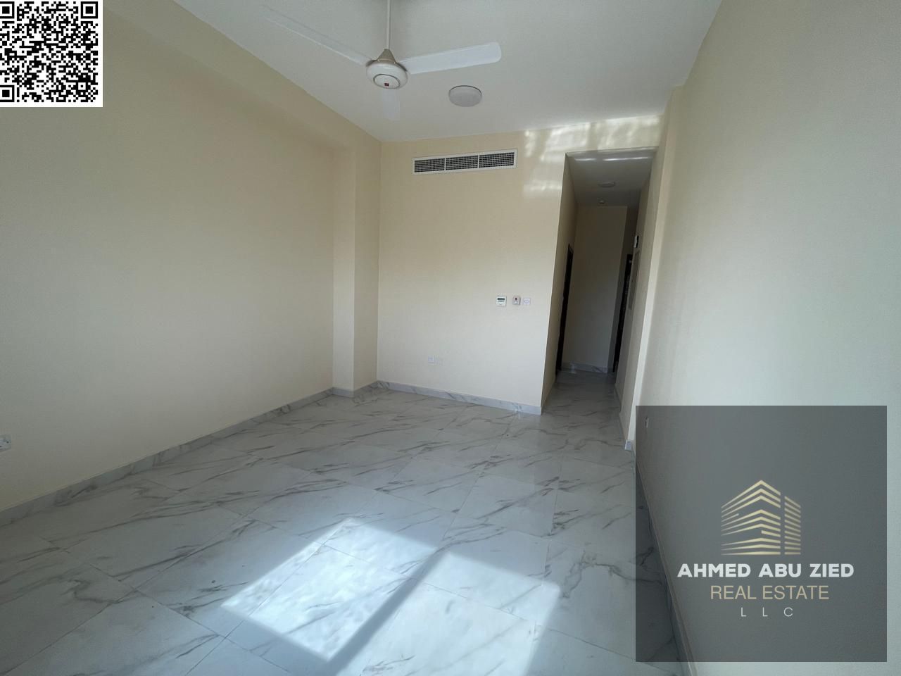 For annual rent: Two-bedroom apartment with a living room, two bathrooms, and a balcony in Al Aaliyah. Prime location near the Dubai exit, at a reason