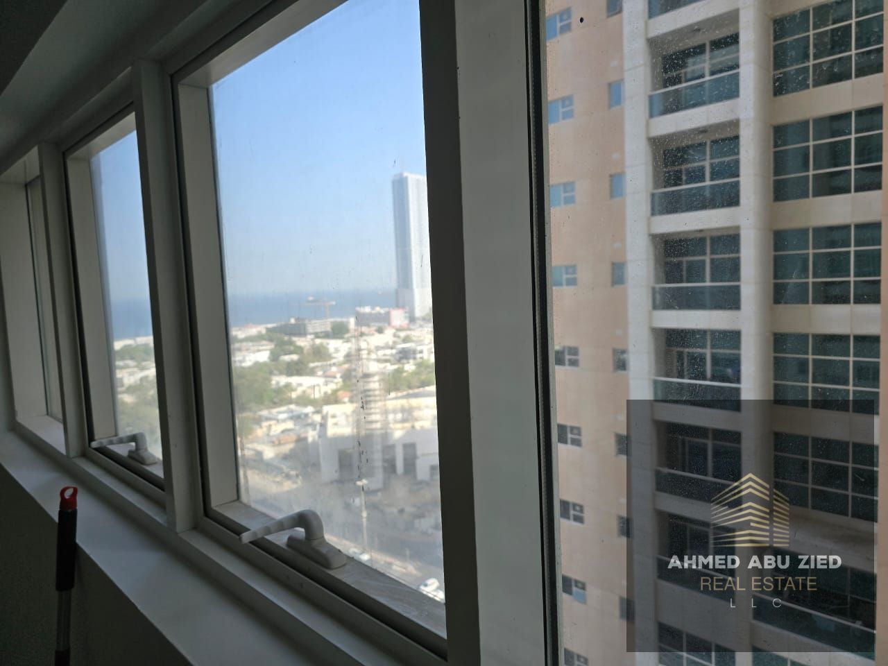 Here’s a concise English version around **150 characters**: **2BR + living in Ajman One Towers, Al Rashidiya, 10th floor, 3 baths, 2 balconies, disti