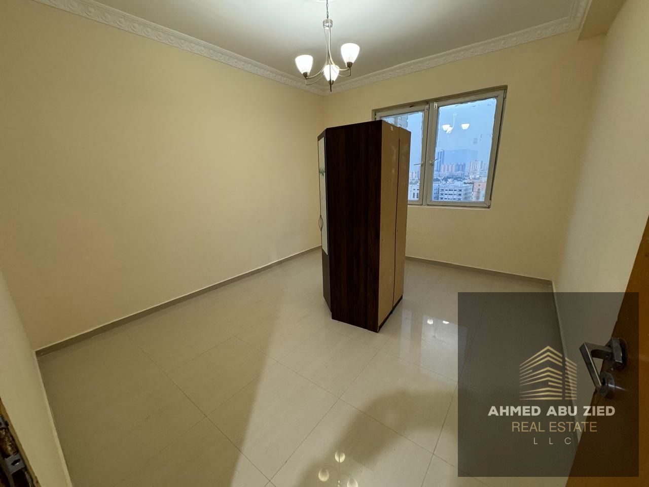 Two-bedroom apartment with a living room for annual rent in Al Nuaimiya 3. One bedroom is master, with two bathrooms, a balcony with an open view, and