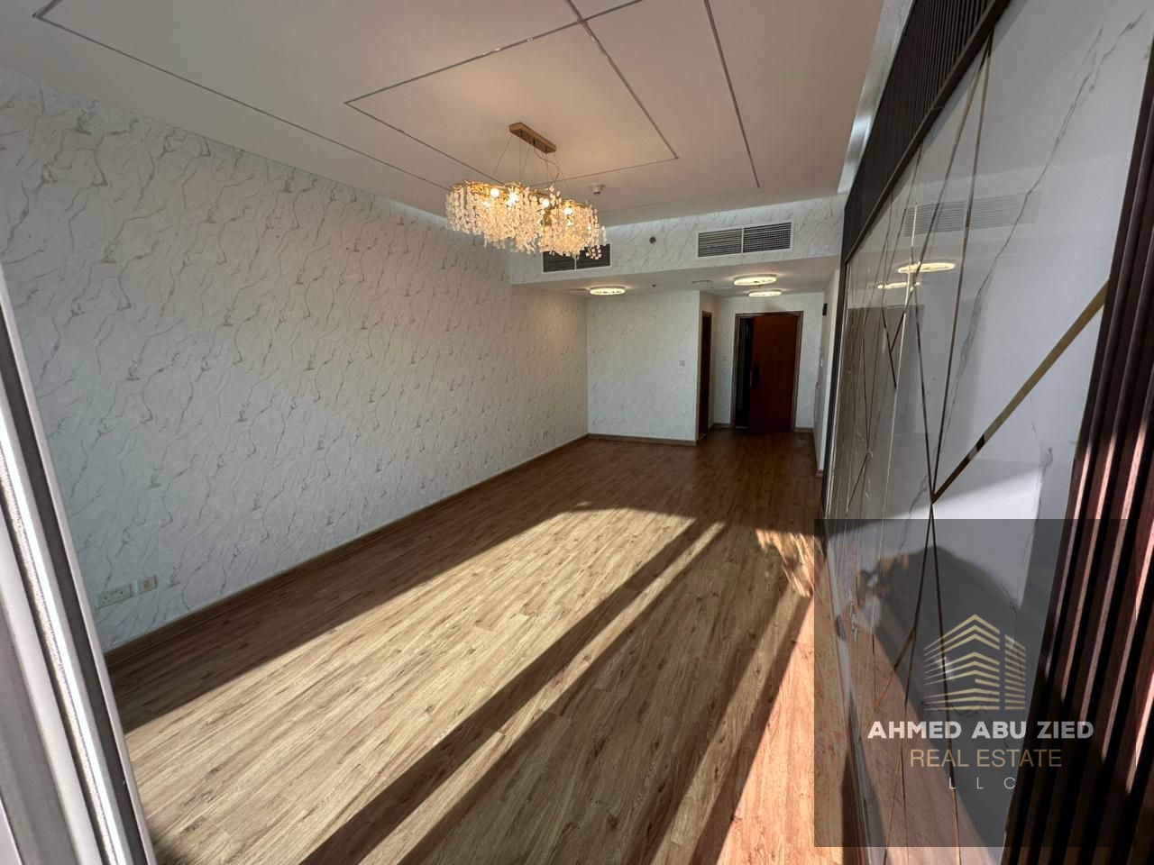 **3BR + extra room & lounge for annual rent in Ajman One Towers. 5 baths, 2 laundry rooms, private parking, central AC, near Corniche.