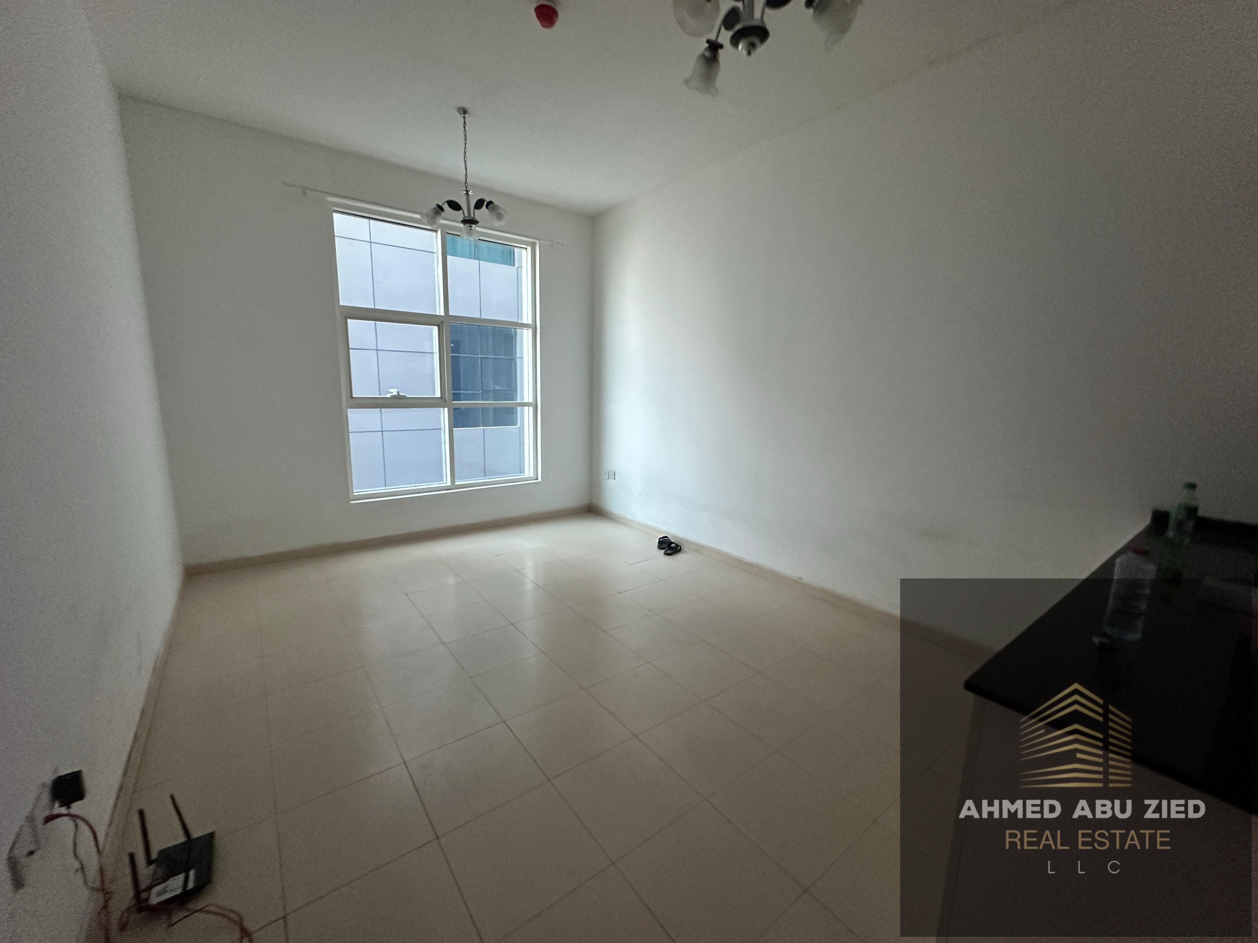 "Room & hall for annual rent in Ajman, City Tower – Al Teimiyah 3.2 baths, central AC, balcony, opposite Grand Mall. "