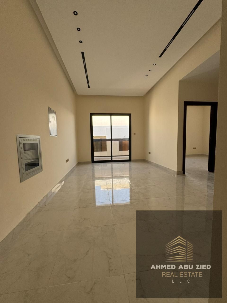 Luxury master bedroom + living room for rent in Al Jurf 3, first occupancy. 2 baths, balcony, central AC, super deluxe finishing, 1 month free.