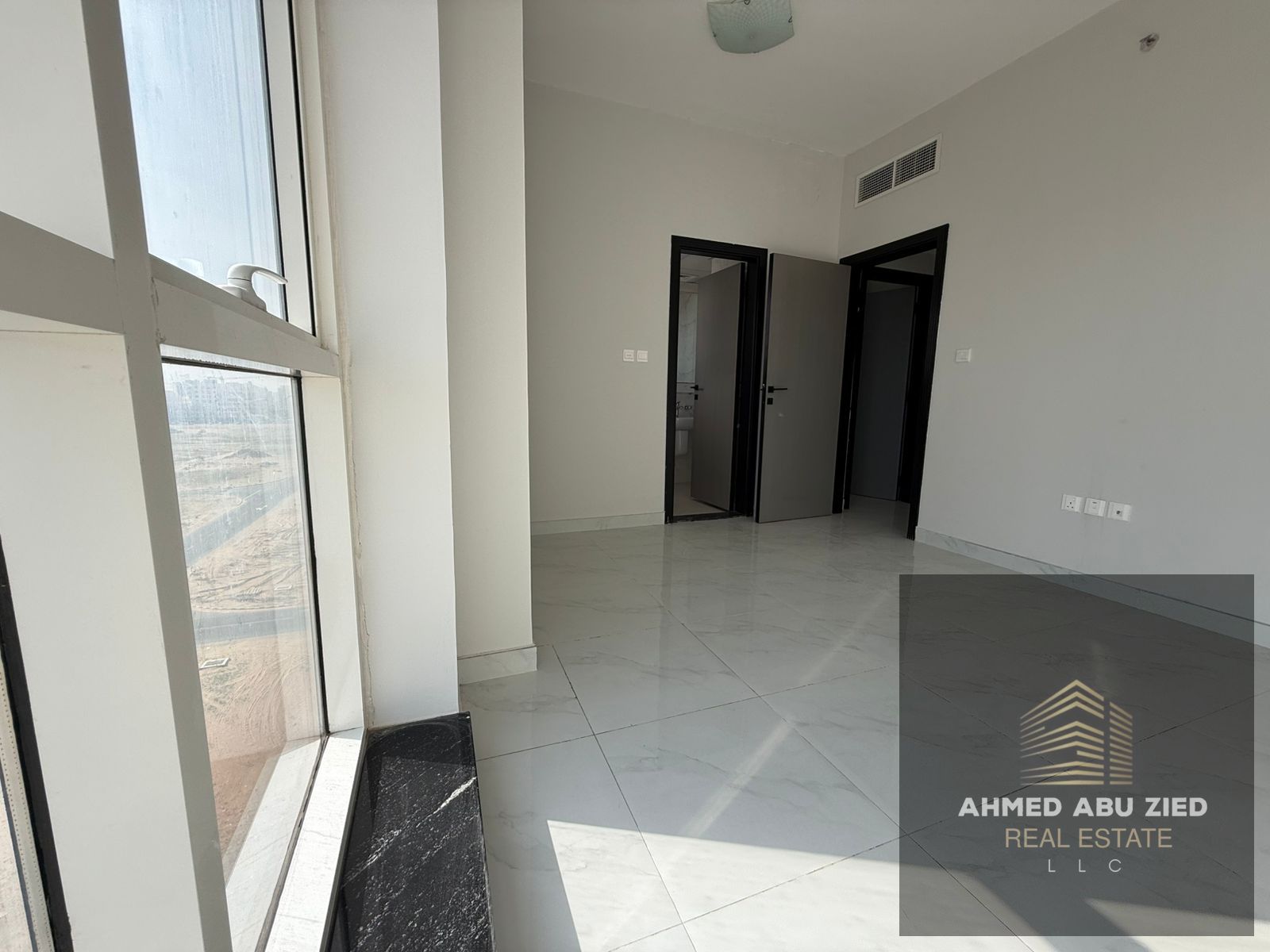 **Two Bedrooms & Living Room for Annual Rent – Al Jurf 3, Ajman** First occupant, both bedrooms are master, 3 bathrooms, free parking, and central air