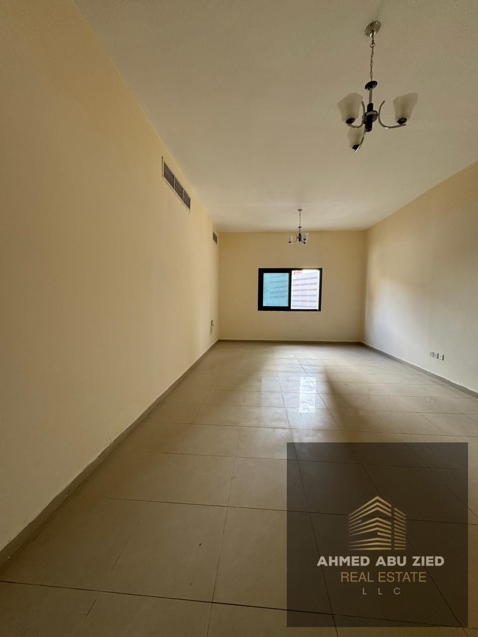2BR + living room, Rashidiya 3, 2 baths, central AC, balcony, near Al Amour Restaurant & Grand Mall. Prime area, great price.