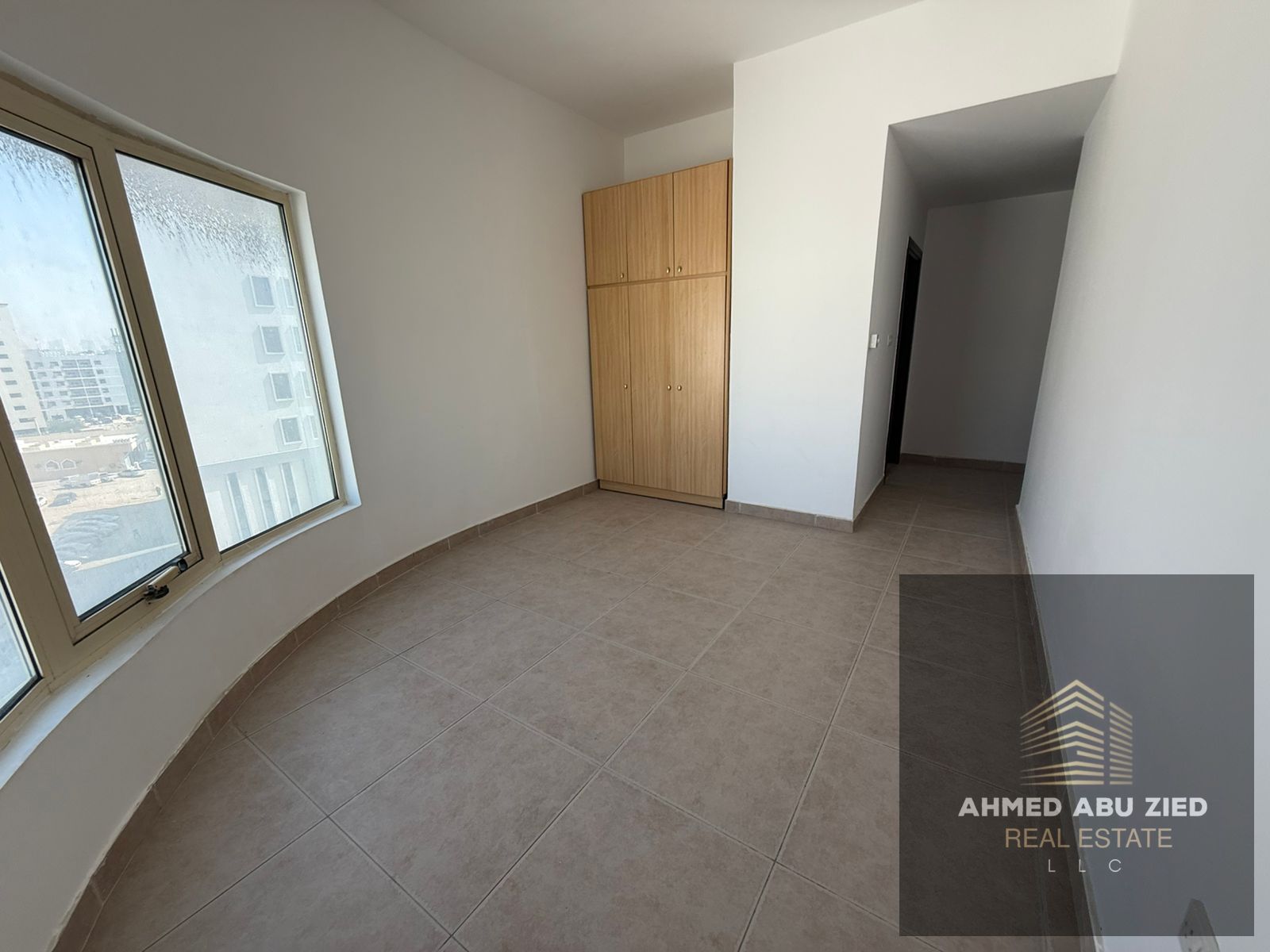 Largest 2BR + living room for annual rent in Ajman, Al Rawda 2. Two master bedrooms, 3 bathrooms, balcony, built-in wardrobes, split AC.