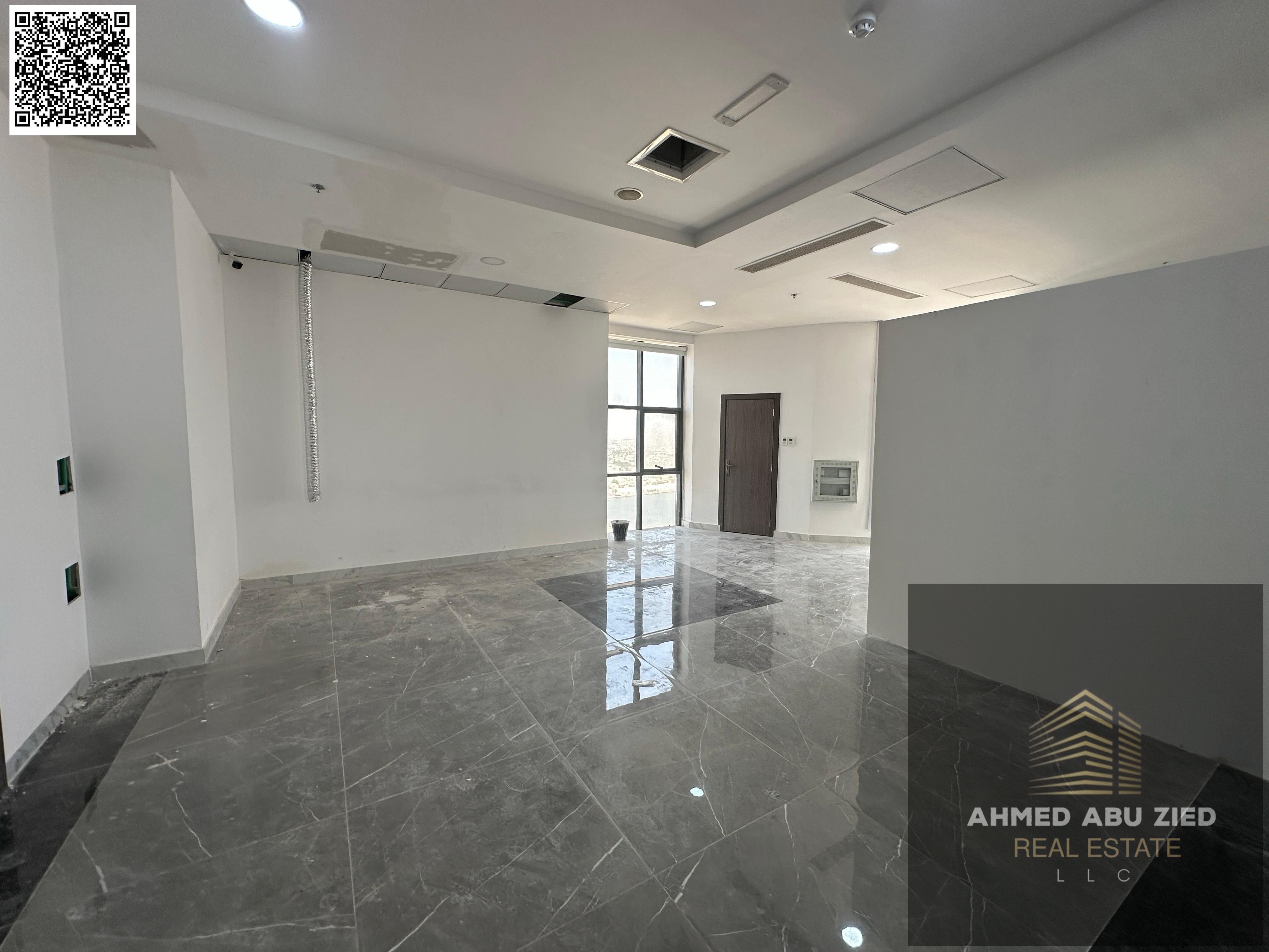 Full floor office for annual rent in Ajman, Al Rashidiya, with creek views, parking, gym, and swimming pool.