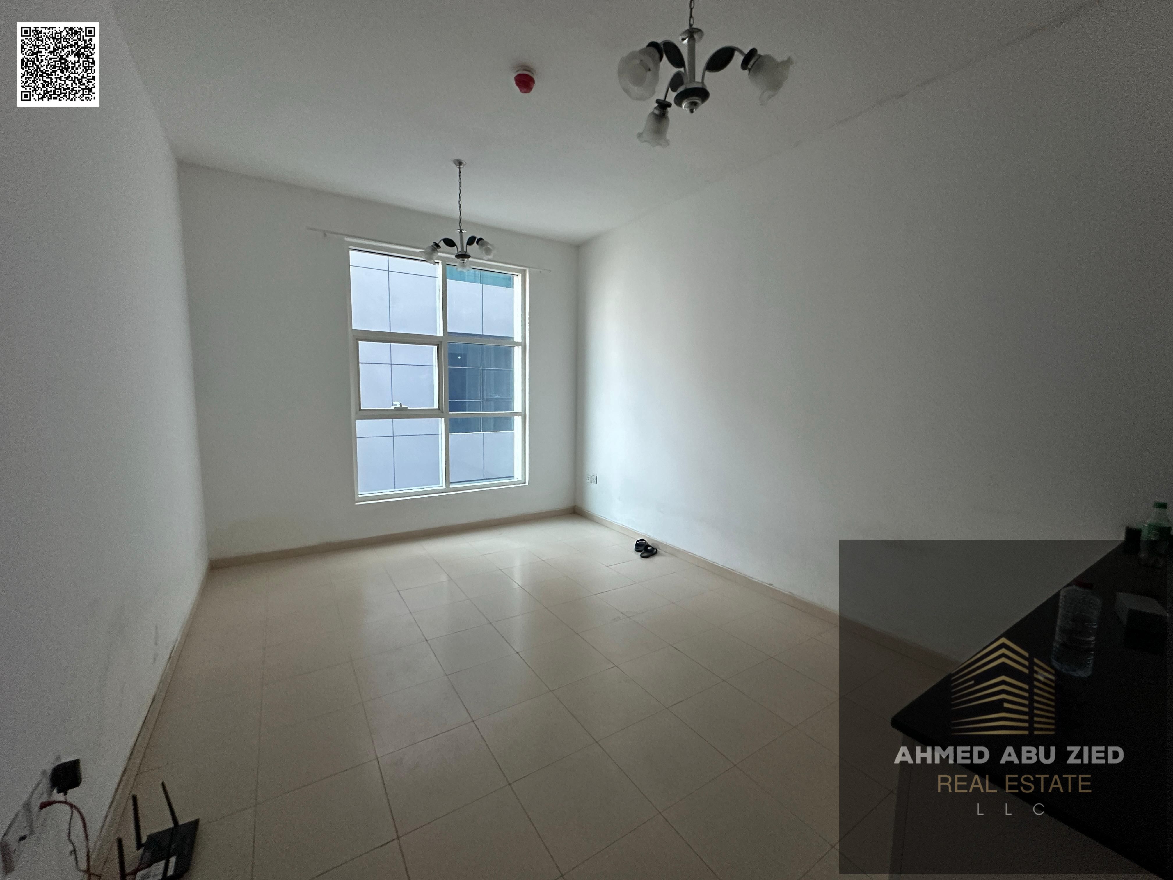 One bedroom and living room for annual rent in Ajman, City Towers, opposite and next to Dana Mall. Excellent location, great size.