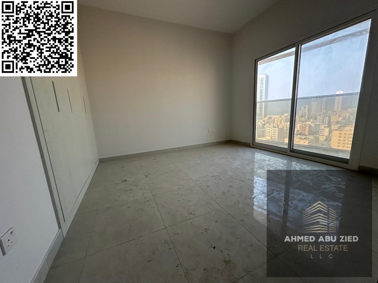 One bedroom and living room, first occupancy in Al Rumaila, near Ajman Corniche, with 2 balconies and parking — high-end finishing and an unmissable p