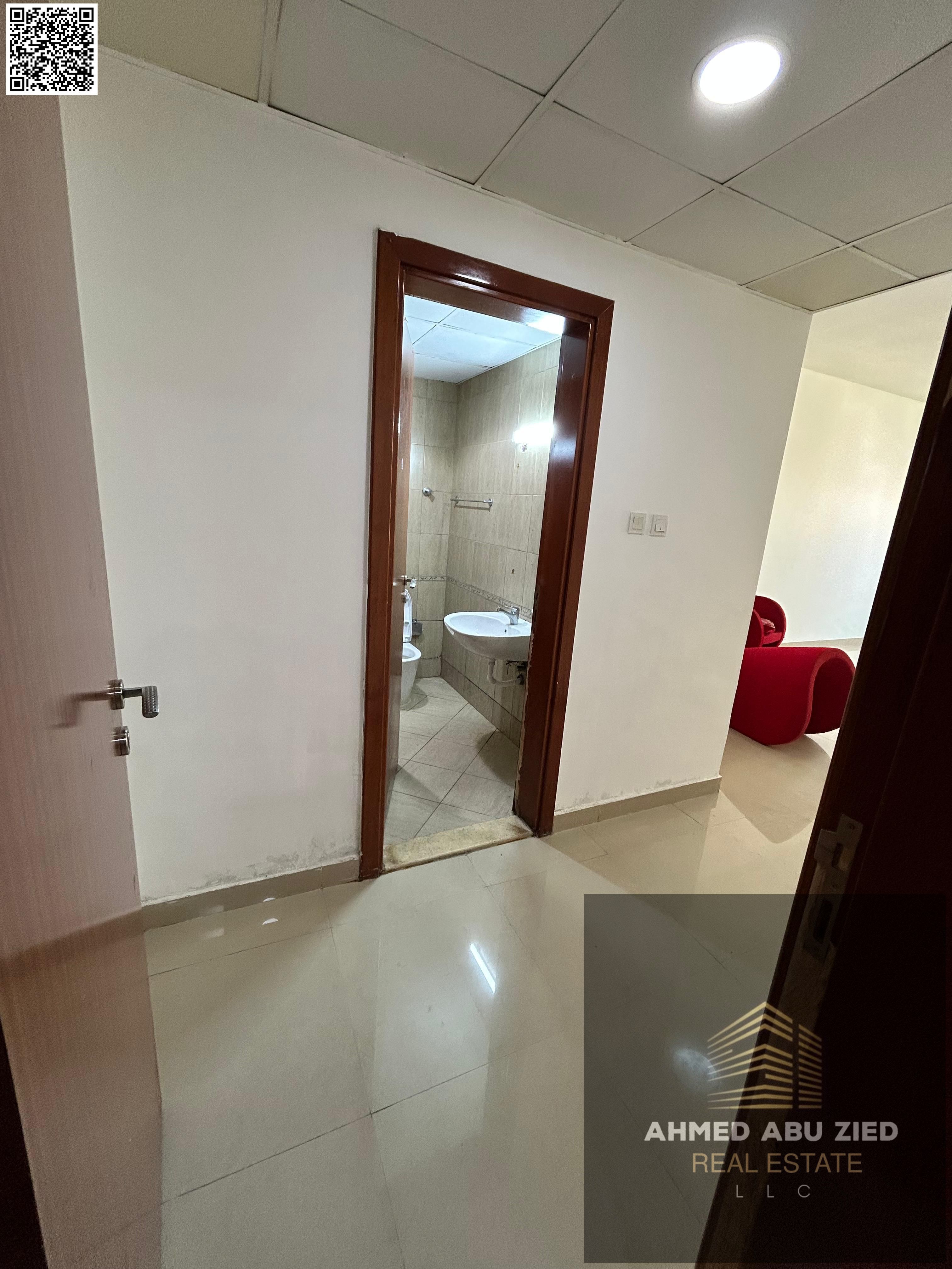 "Two-bedroom apartment with a living room for annual rent in Ajman - huge space and balcony, only 45,000 dirhams per year!"