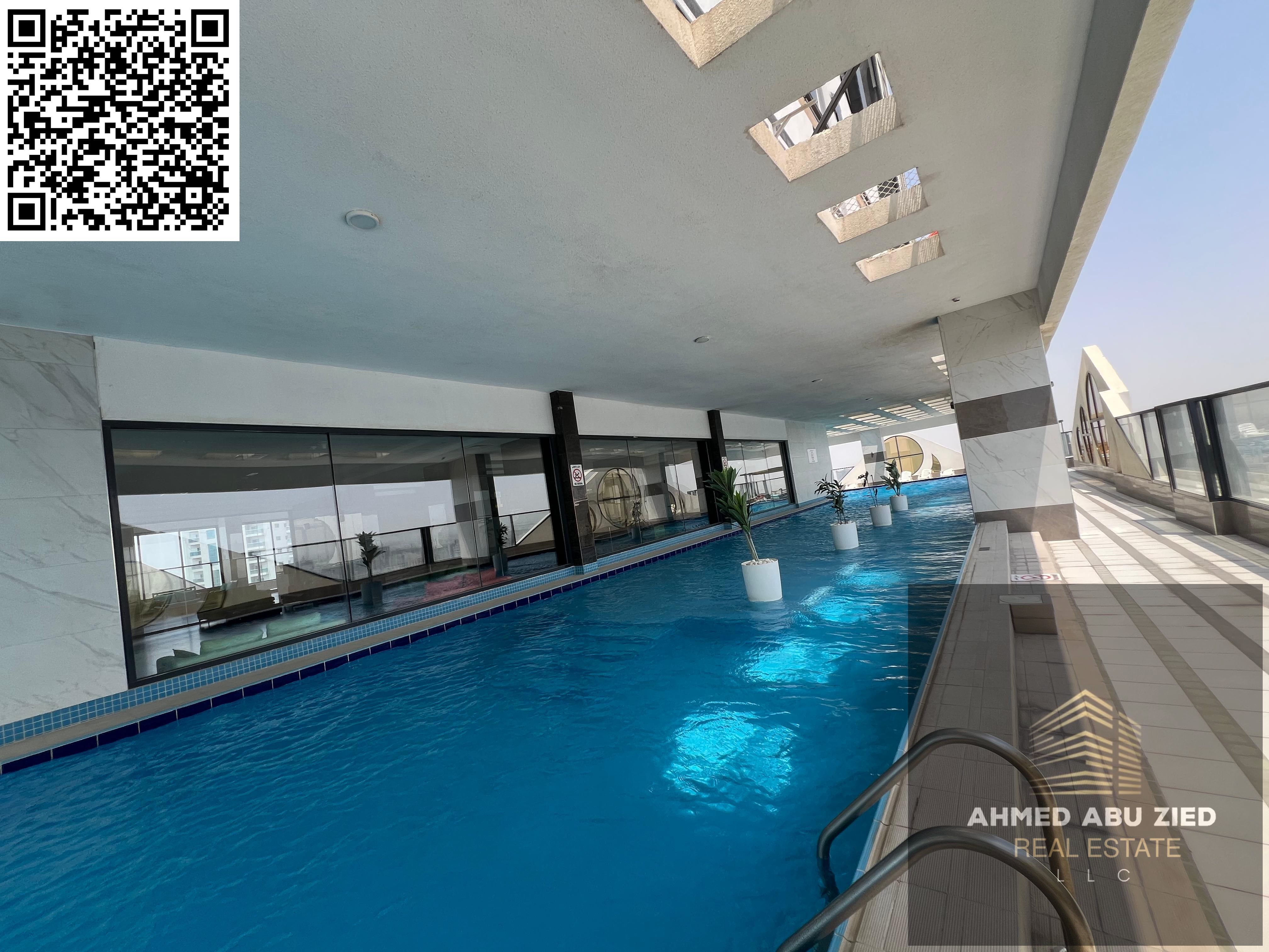 Top-of-the-line two-bedroom apartment for annual rent in Ajman Al Rashidiya – Gym, swimming pool, and aqua park