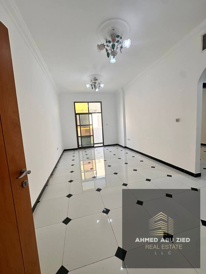 Luxurious and elegant two-bedroom apartment with a master bedroom, living room, maid's room, spacious and modern kitchen, three bathrooms, and a balco