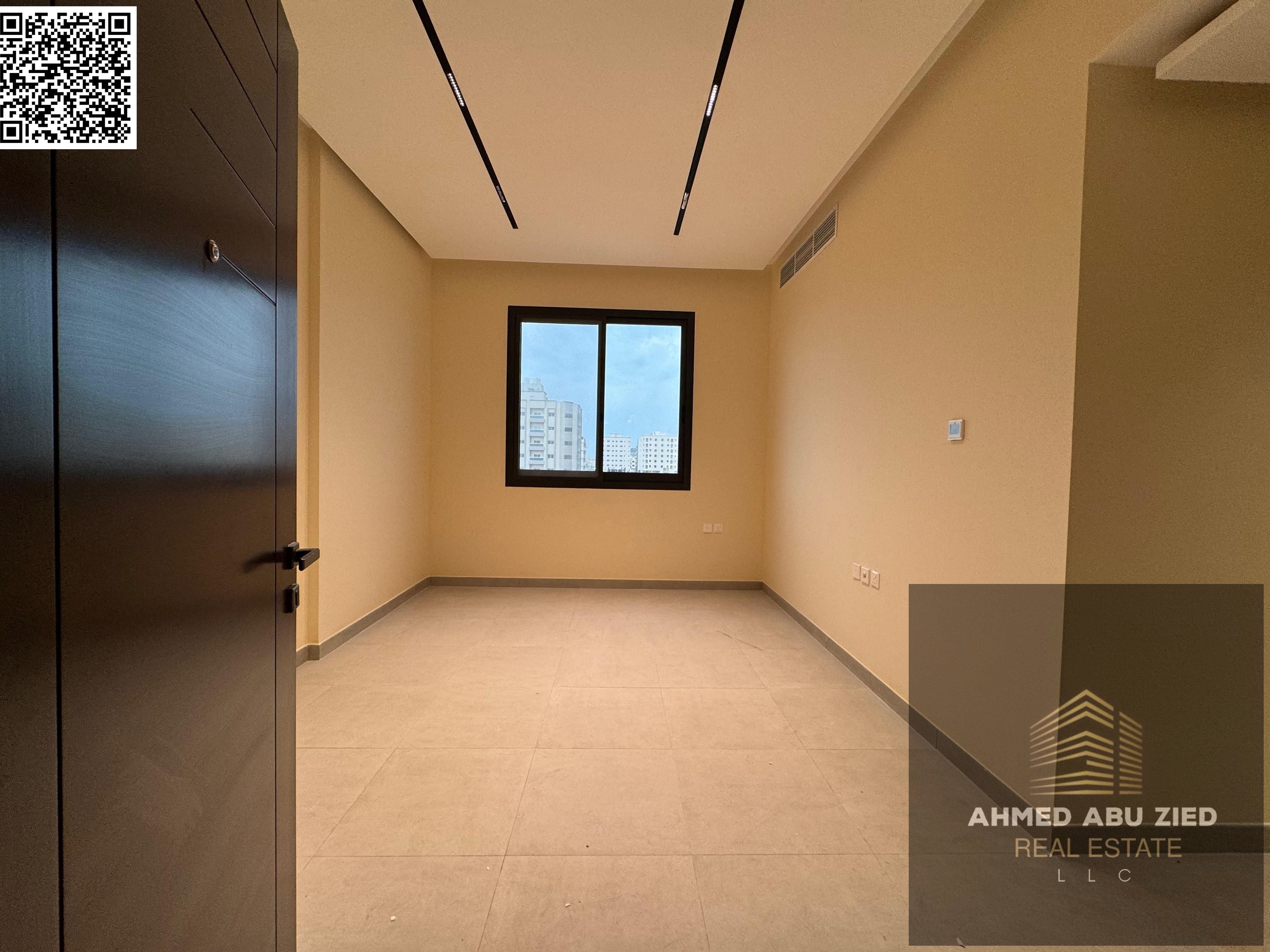 Luxurious and elegant two-bedroom apartment with a large living room, spacious kitchen, balcony with open views, two bathrooms, central air conditioni