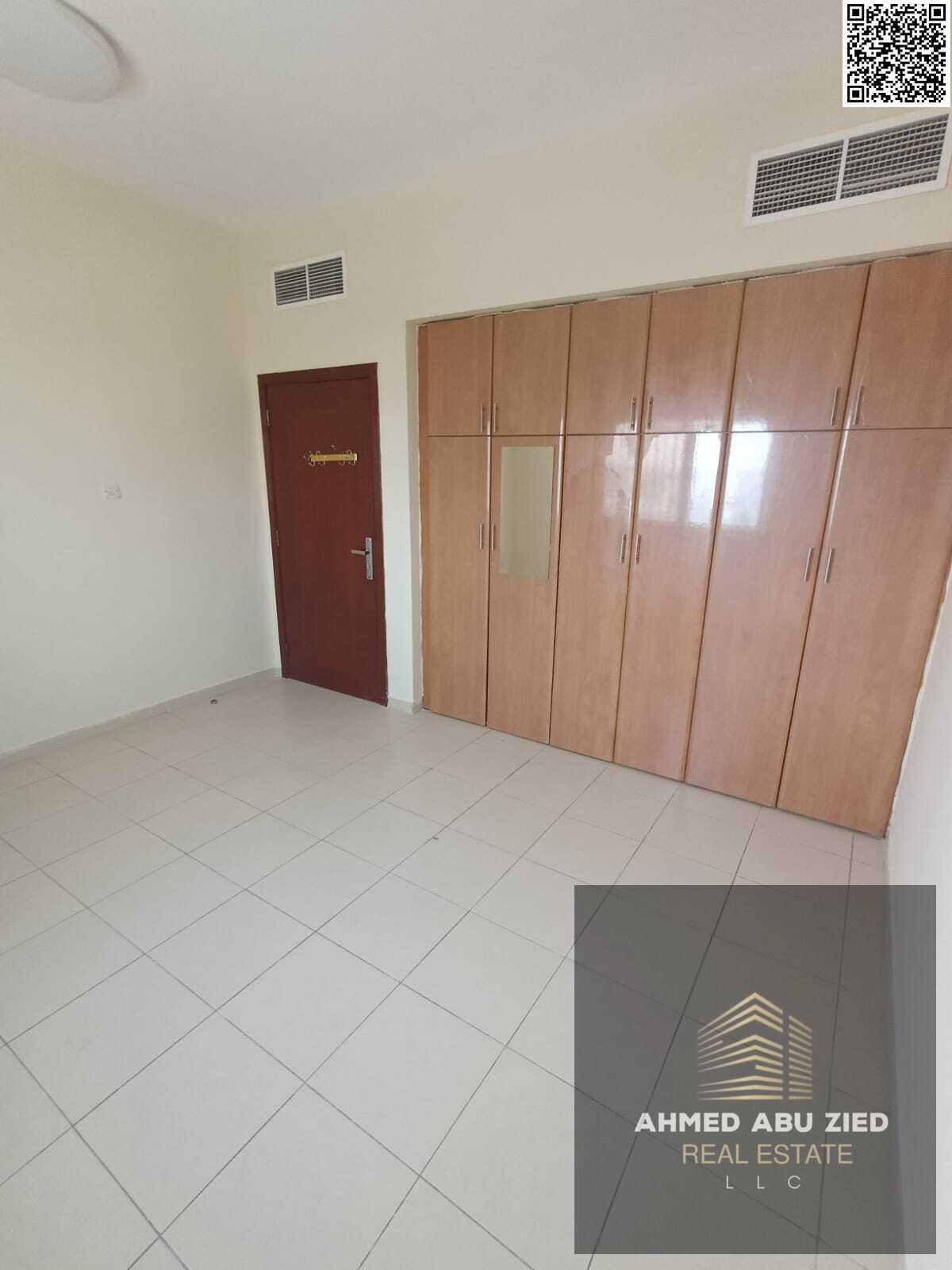 Luxurious and elegant two-bedroom apartment with a large living room, spacious kitchen, two bathrooms, built-in wardrobes, balcony with open views, ce