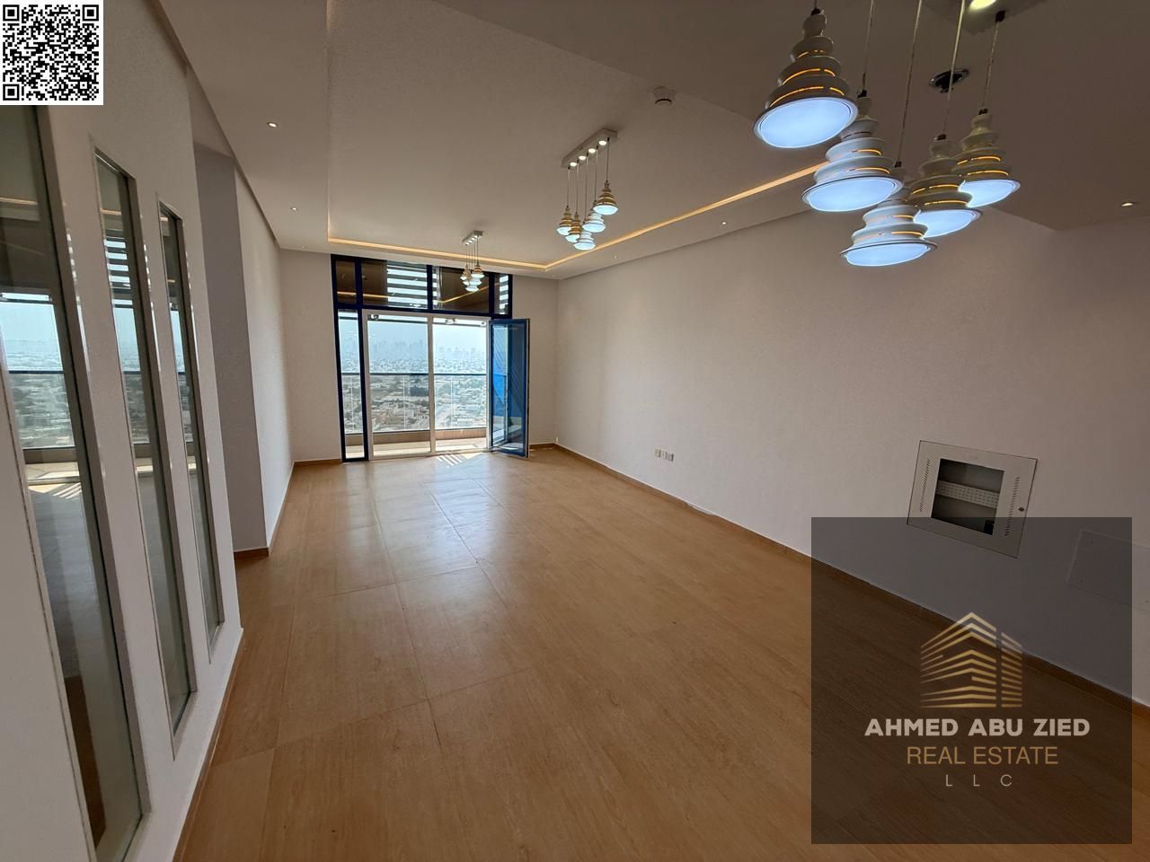Upscale and luxurious 3-bedroom apartment with a large living room, modern kitchen, balcony, open view, 2 bathrooms, central air conditioning, free pa