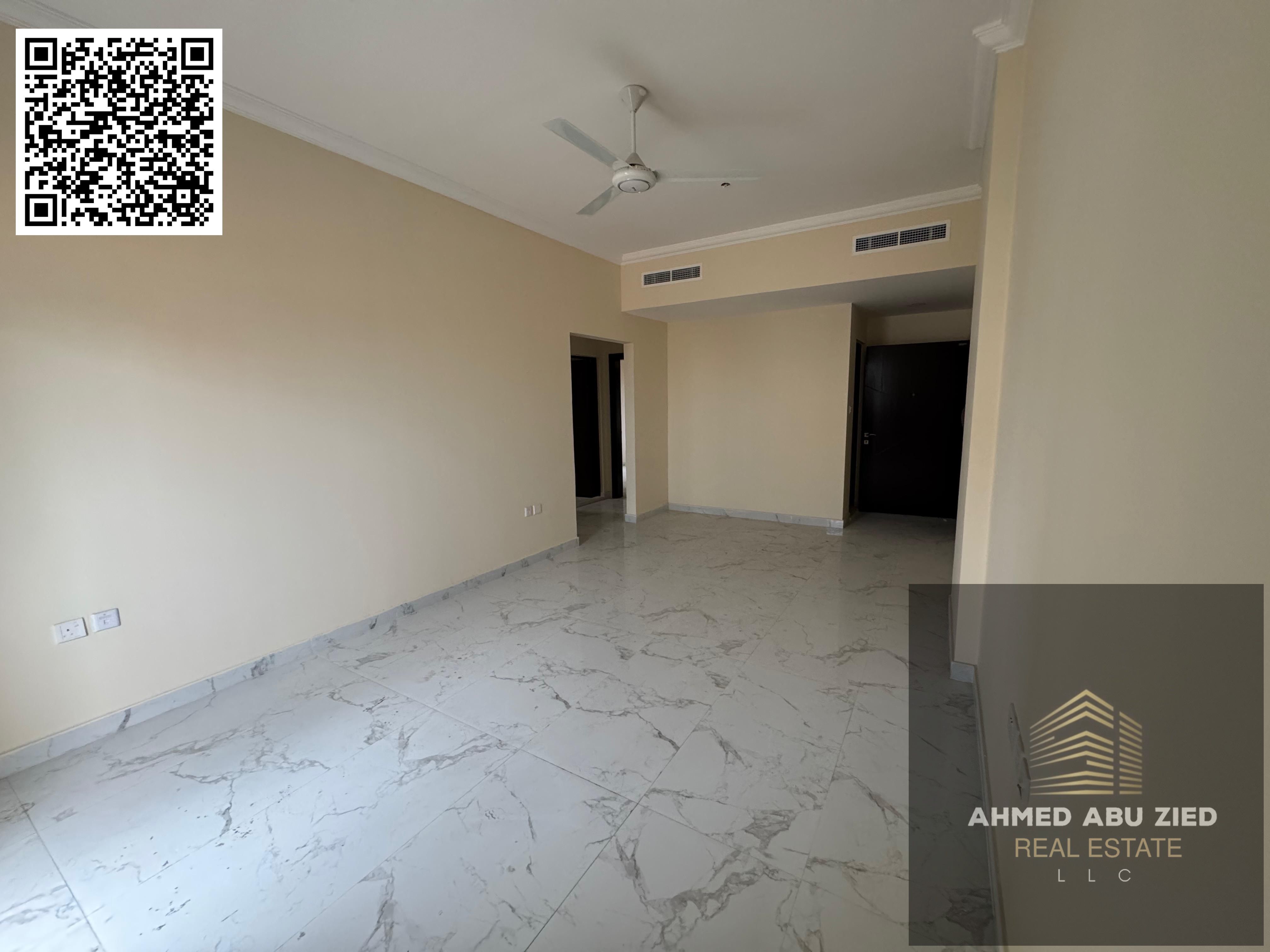 For annual rent in Ajman, Al Jurf 3, first occupancy, two-bedroom apartment with a living room, three bathrooms, balcony, central air conditioning, su