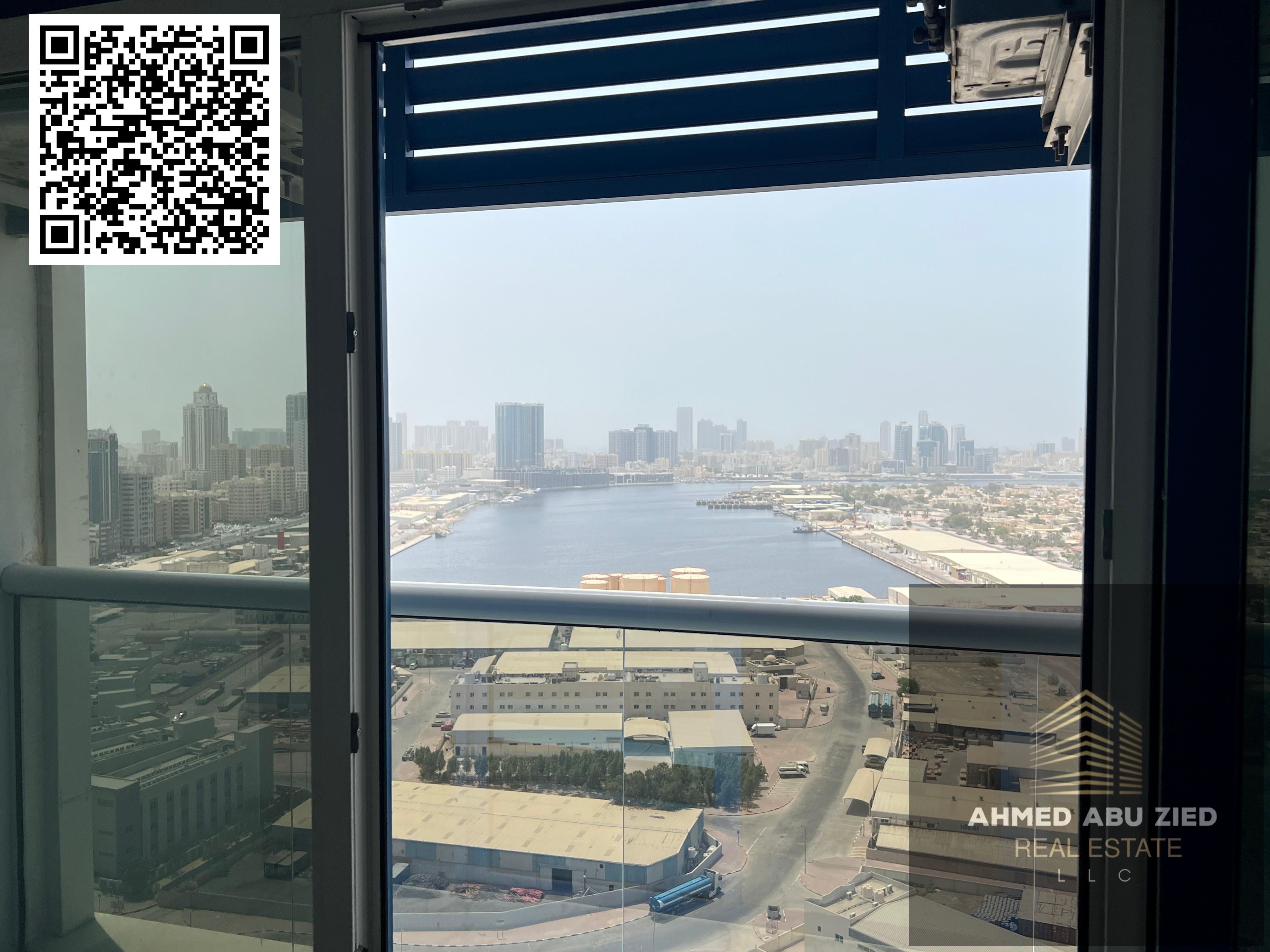 Luxury two-bedroom apartment in Mushrif, Ajman. Features include two bathrooms, a balcony with sea views, free parking, and an annual rent of AED 65,0