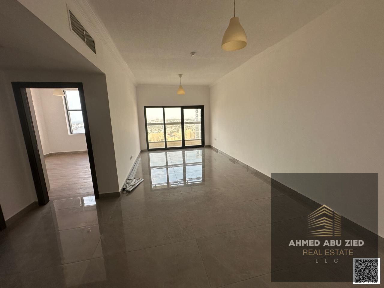 Luxury 1-bedroom apartment with a living room for annual rent in Ajman Tower. Features master bedroom, 2 bathrooms, balcony with open view, appliances