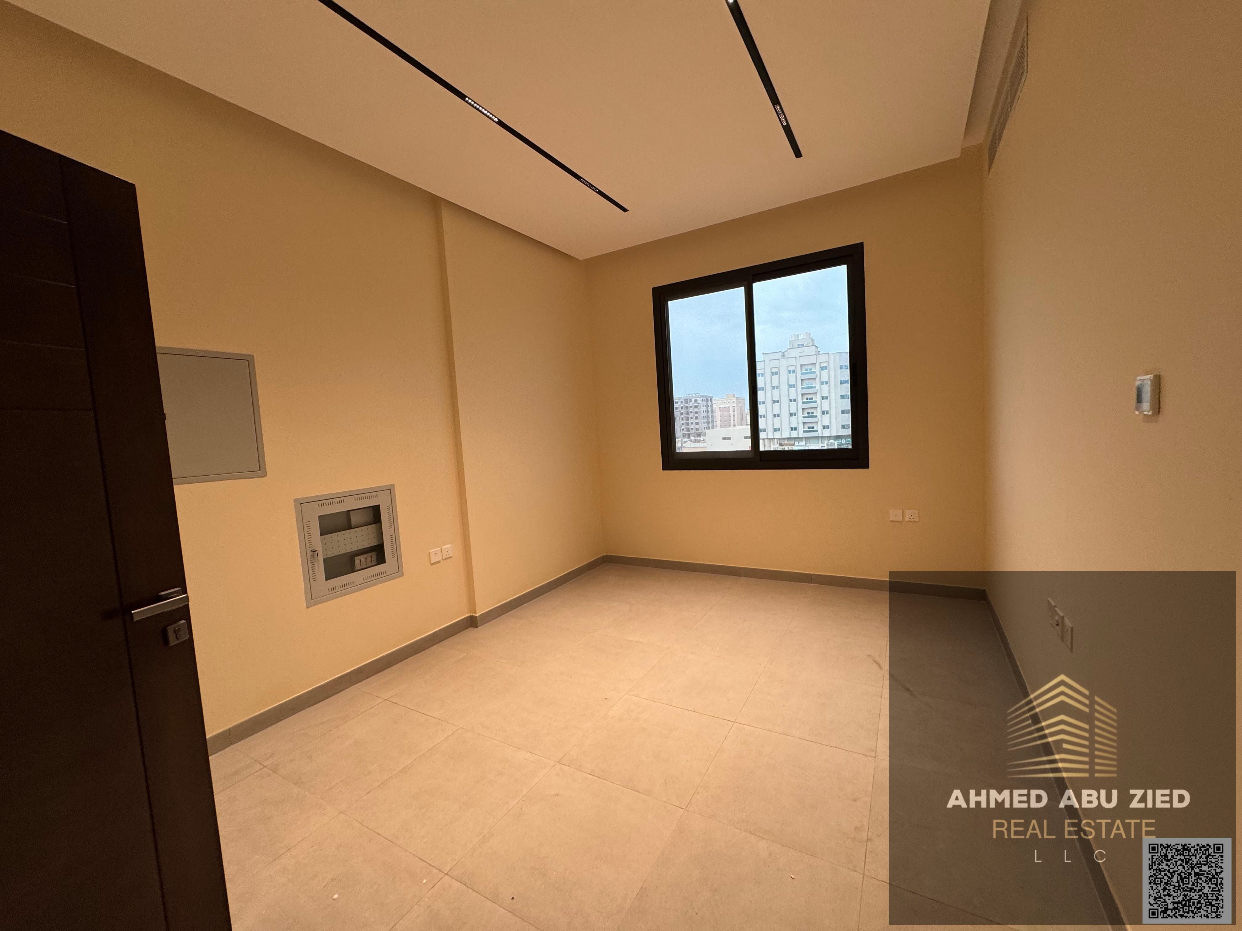 Luxury 2-bedroom apartment with living room for annual rent in Ajman, central AC, balcony, modern lighting & décor, near services, easy access to Shar