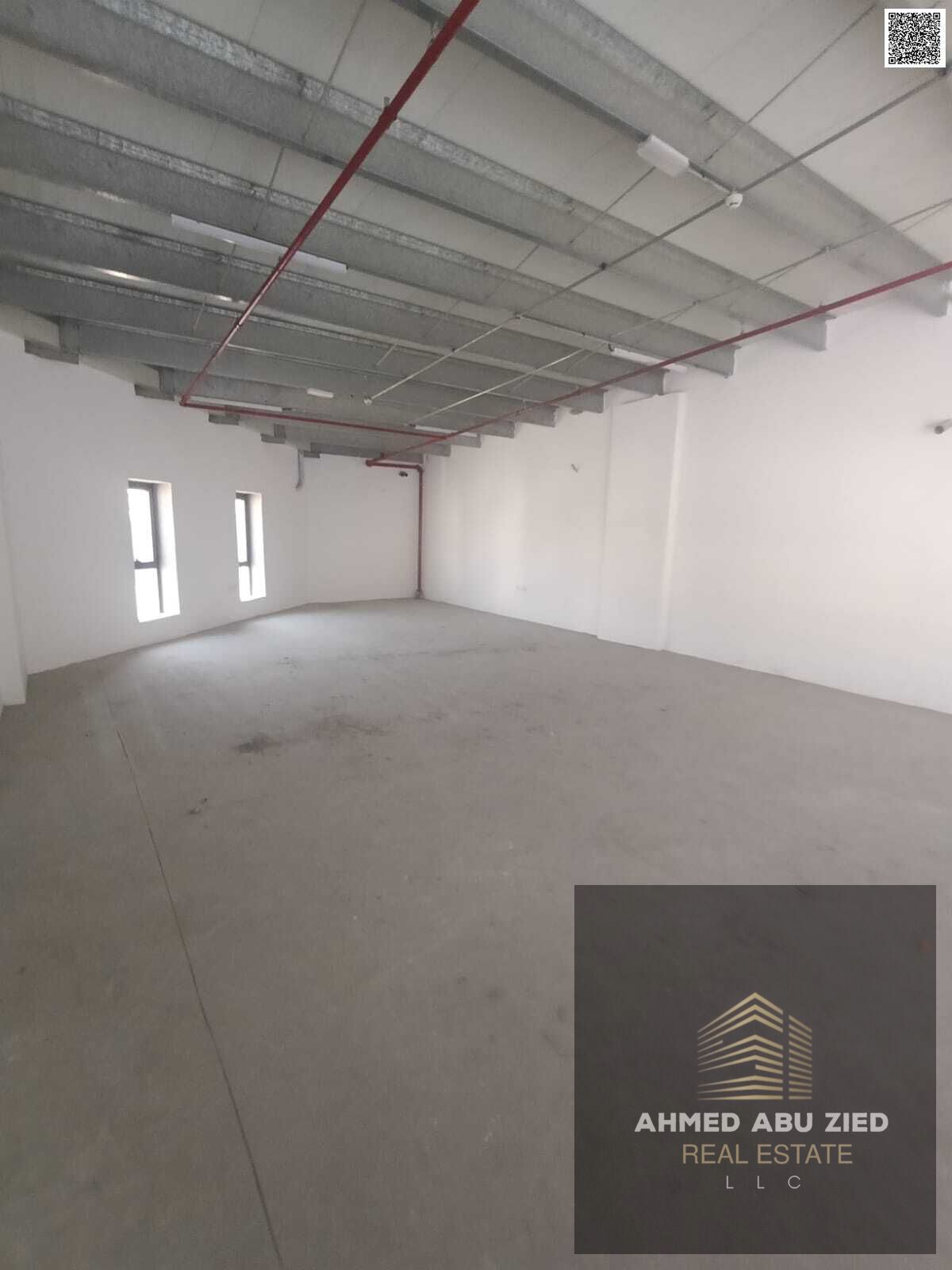 Annual warehouse for rent in Al Jurf Industrial 2, Ajman, on a main road with mezzanine, prime location near Sheikh Mohammed Bin Zayed Road, easy acce