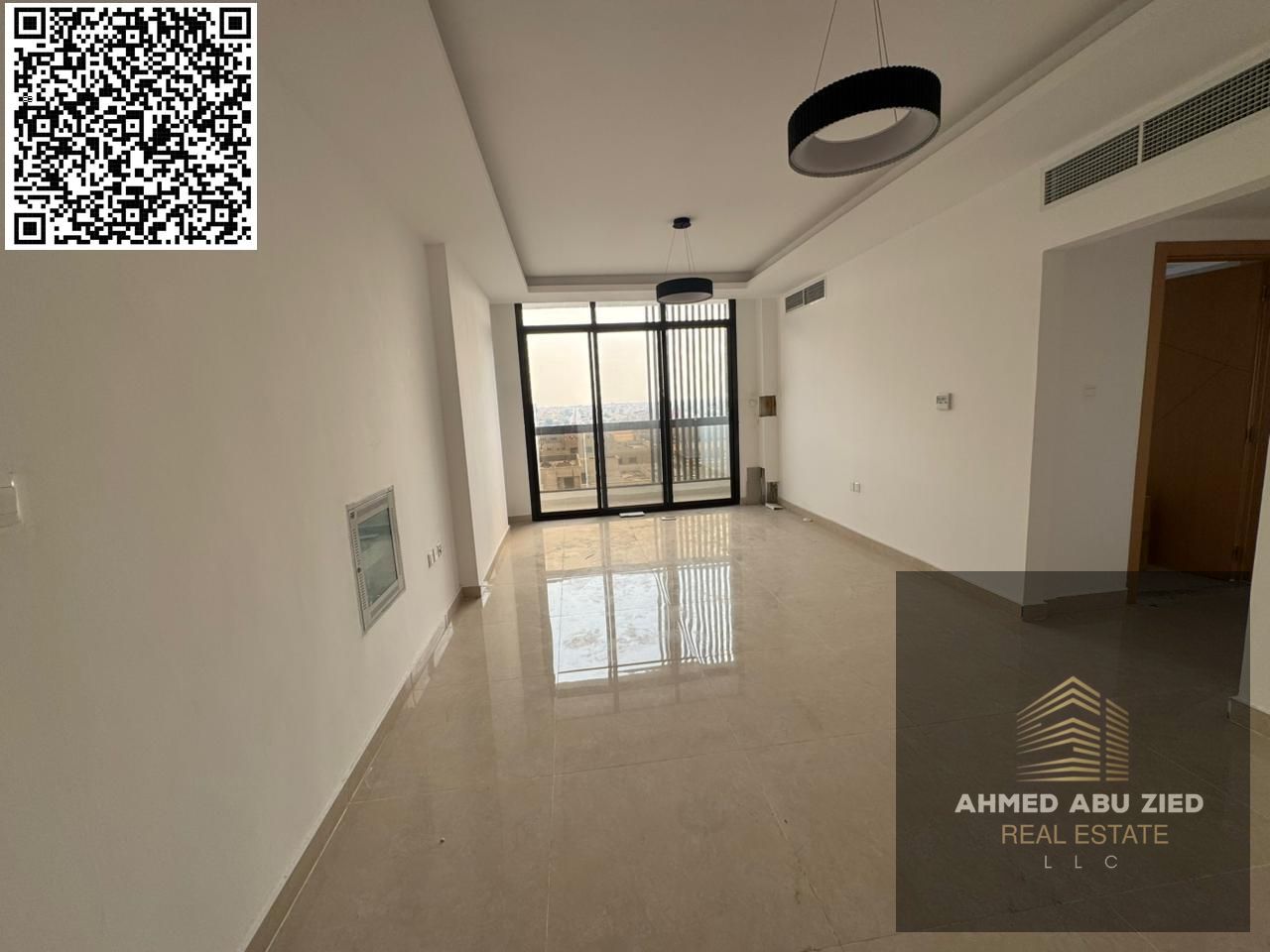 Two bedrooms and a living room with three bathrooms, one month free, brand new building, first occupancy, with a fully equipped kitchen, in Al Jurf 3,