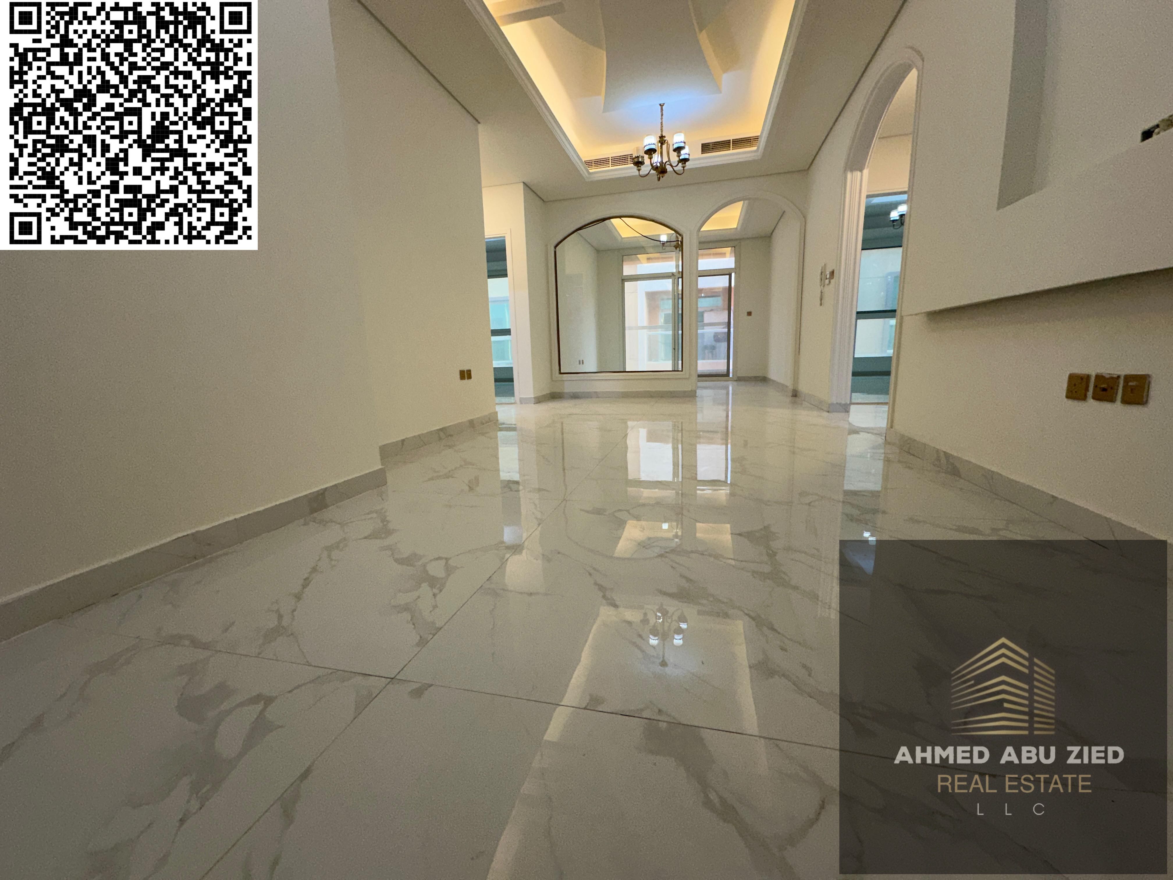 Two-bedroom apartment with a living room, majlis, and balcony with an open view for annual rent in Al Muwaihat 3, near Schools Street and ADNOC statio