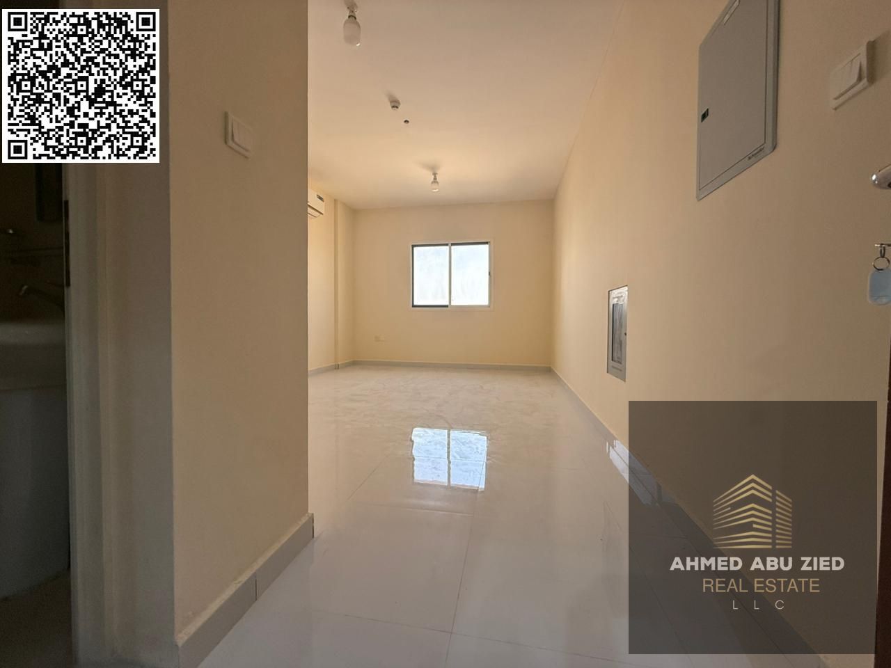 Staff accommodation available for annual rent in Ajman. A one-bedroom apartment with a living room, two bathrooms, spacious layout, and split air cond
