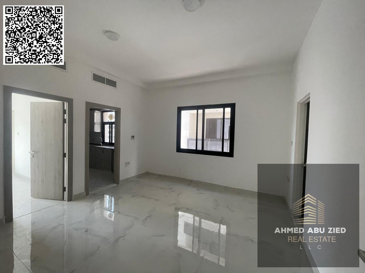 For annual rent in Ajman, a spacious one-bedroom apartment with a living room, two bathrooms, and split air conditioning in all rooms is available in