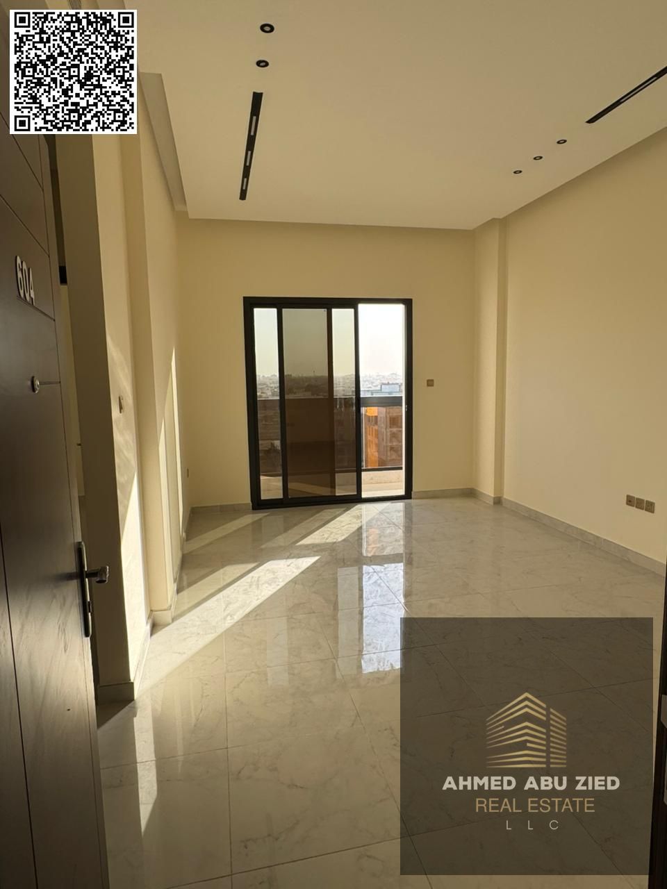 For annual rent in Ajman, a brand new building in Al Jurf 3, first occupancy. Two bedrooms, a living room, three bathrooms, a balcony with an open vie