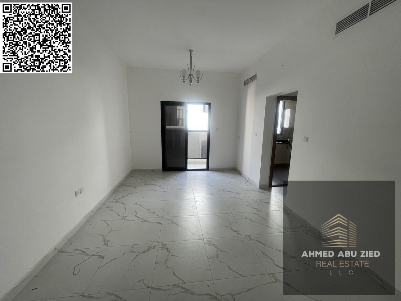 For annual rent in Ajman, a brand new building offers a one-bedroom apartment with a living room, two bathrooms, a balcony with an open view, spacious