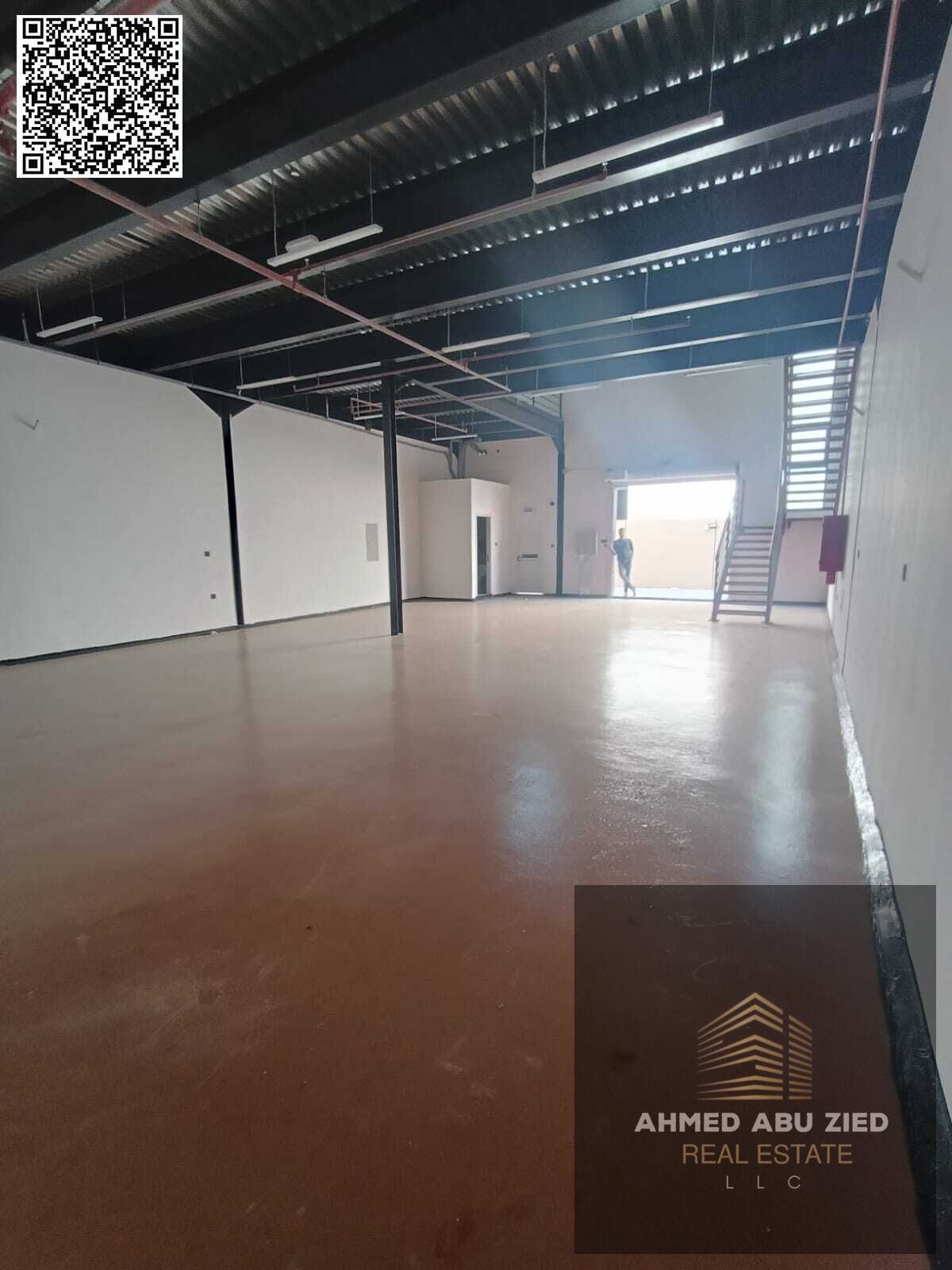 Large commercial warehouse with a mezzanine and two bathrooms, offering ample space suitable for all large businesses, strategically located in Al Jur